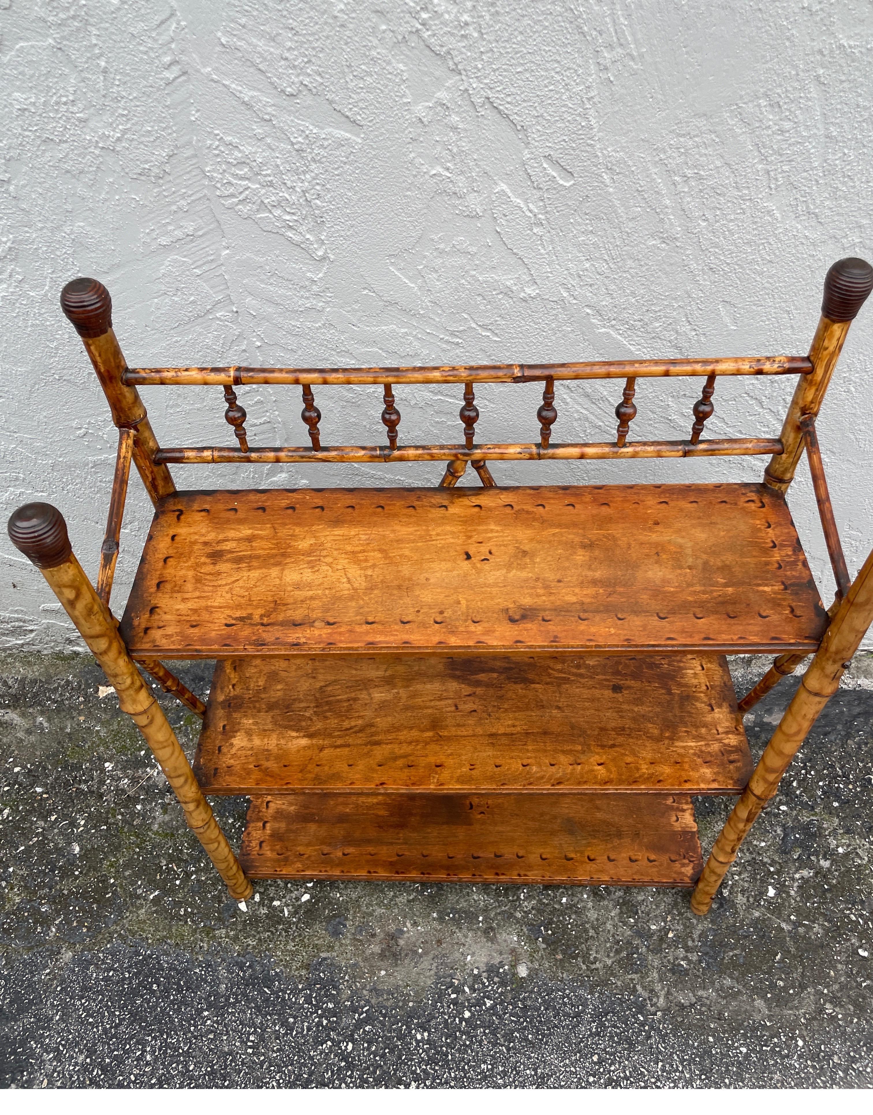 Antique bamboo three shelf stand. Perfect for next to a chair or can be used on a table top.