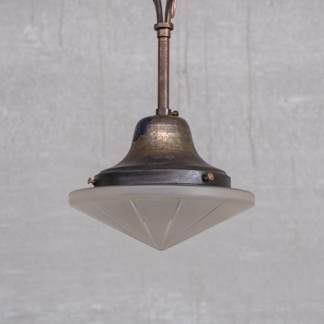 A small but good quality antique pendant light. 

France, c1930s. 

Naturally patinated brass and etched conical glass. 

No chain or rose was retained. We can provide at cost. 

Location: Belgium Gallery. 

Dimensions: 30 H x 20 Diameter
