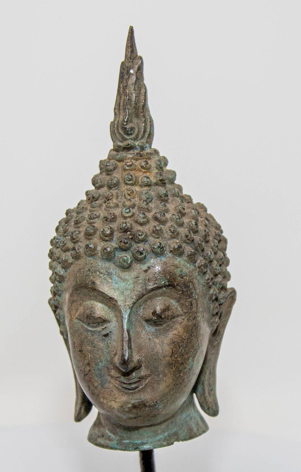 Tibetan Small Antique Bronze Buddha Head Sculpture with Verdigris on Stand For Sale