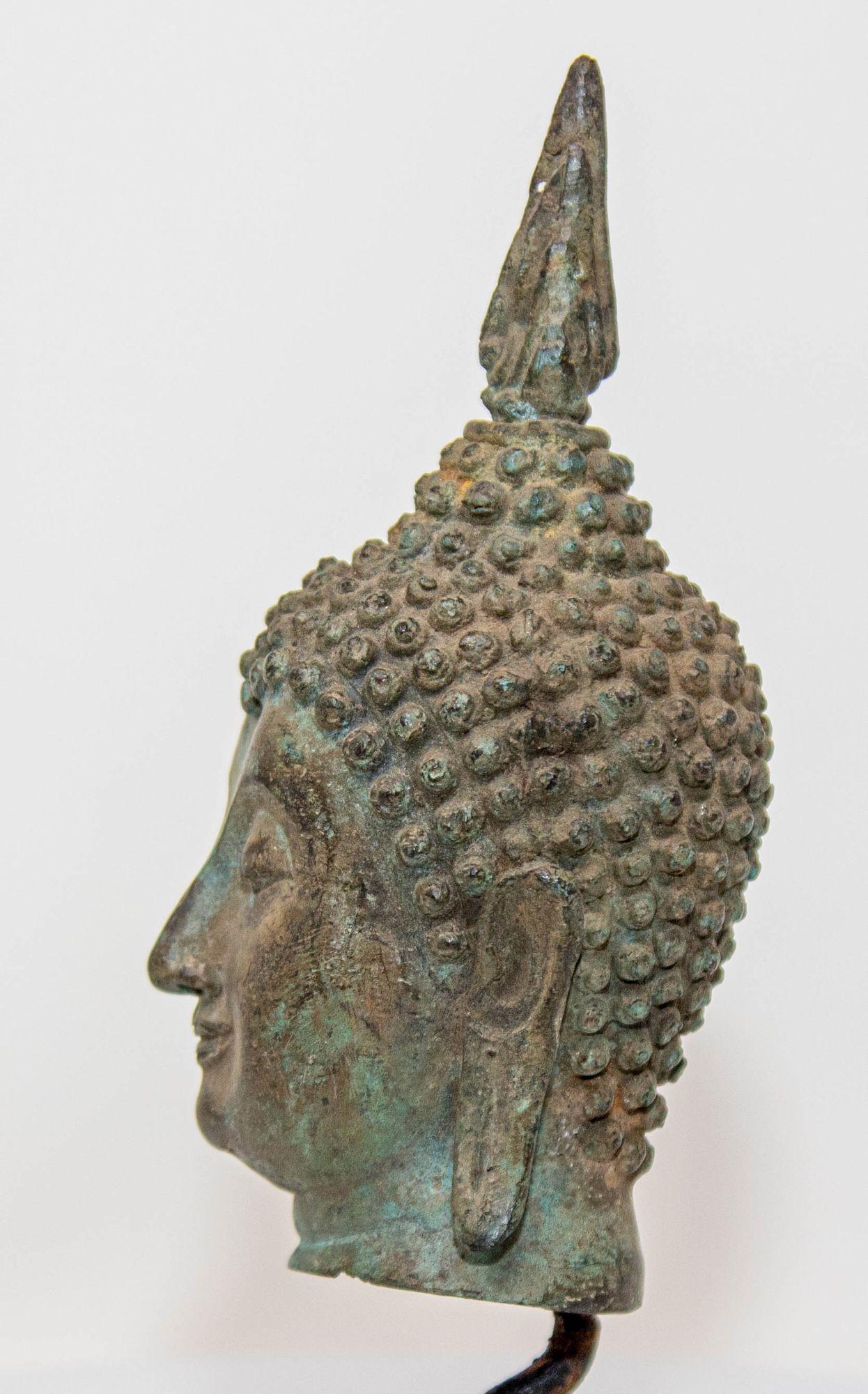 Cast Small Antique Bronze Buddha Head Sculpture with Verdigris on Stand For Sale