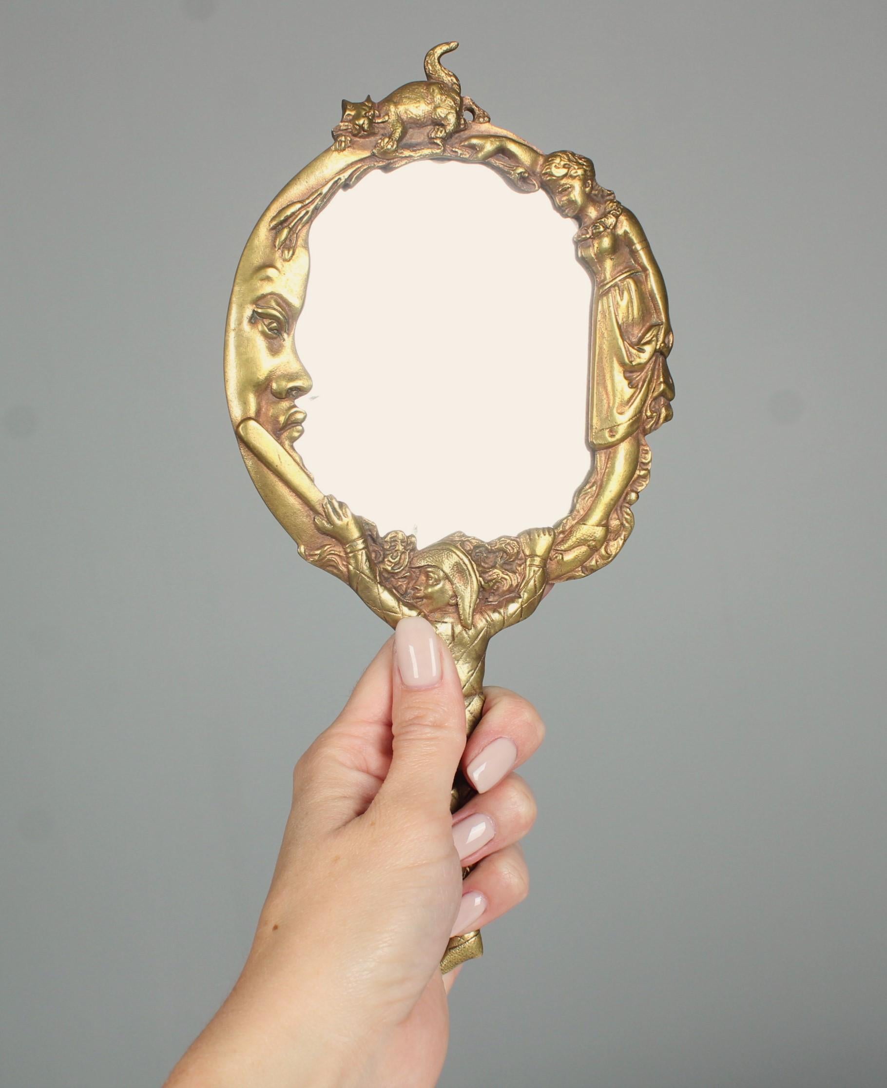 Beautiful antique handheld mirror made of bronze.
Facated mirror with signs of age and use.
Suspension on the back.