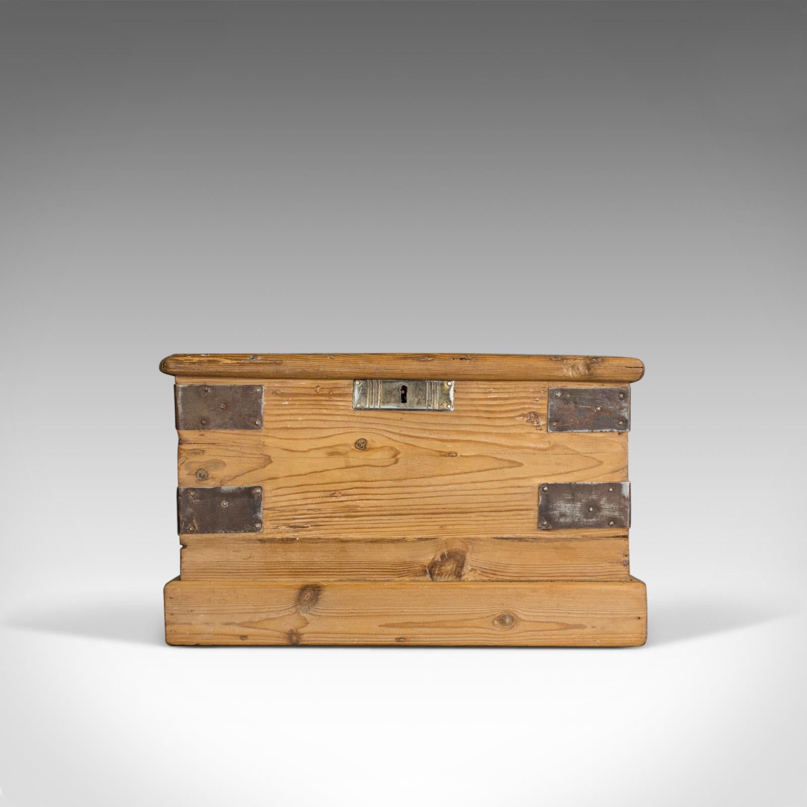 This is a small antique carriage chest. An English, Victorian, metal-bound pine trunk dating to the mid 19th century, circa 1870.

Crafted in antique pine displaying grain interest throughout
Good consistent colour and a desirable aged patina
Of