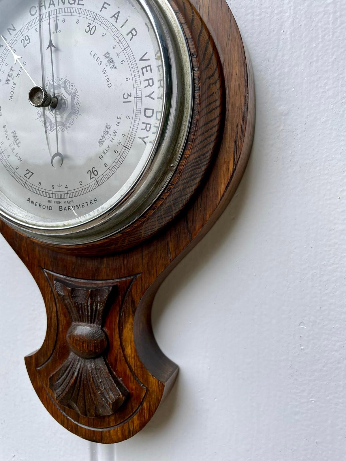 Small antique carved oak barometer having a shaped carved oak case with a thermometer and a 7 inch silvered dial with original hands.

A fine example of desirable proportions in lovely condition and good working order.

Measures: H 58.5cm
W