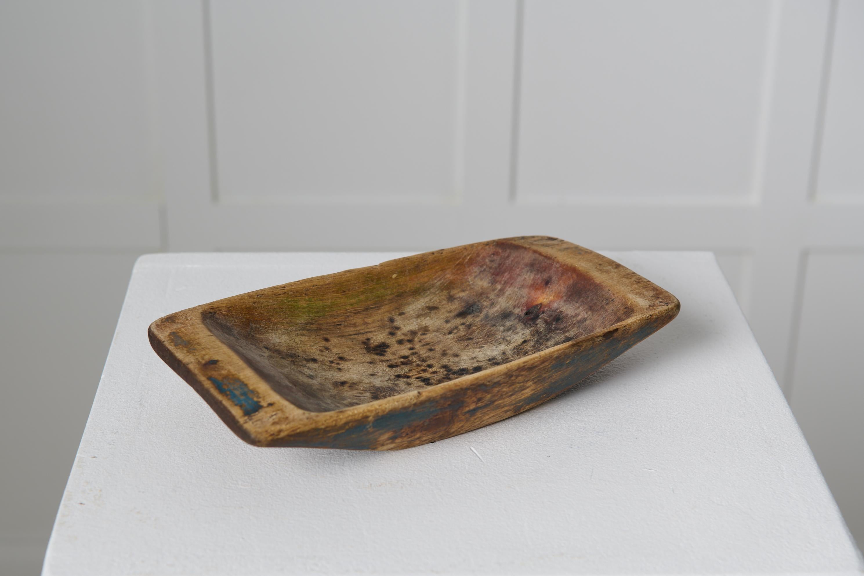 Smaller charming wooden trough from the mid 1800s, northern Sweden. Very unusual folk art item given that it is so small. Made by hand and in untouched condition which shows traces of history with distress and patina. Owners mark underneath. Wooden