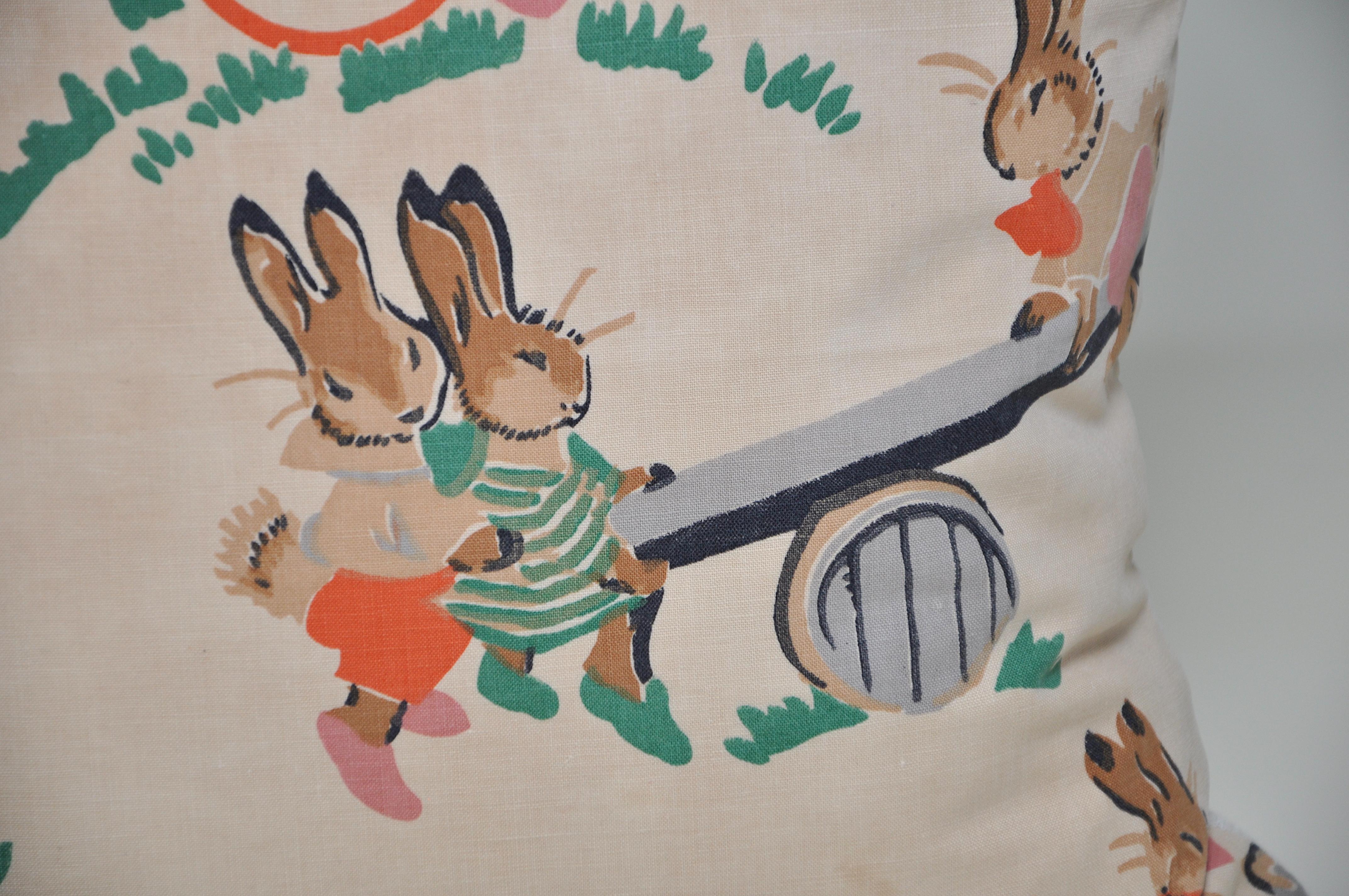 Custom-made one-of-a-kind luxury cushion created from an exquisite piece of rare antique fabric. Depicting gorgeous anthropomorphic rabbits, reminiscent of Alan Wright’s 1930s ‘Bunnykins’ which and Beatrix Potter’s ‘turn of the century Peter
