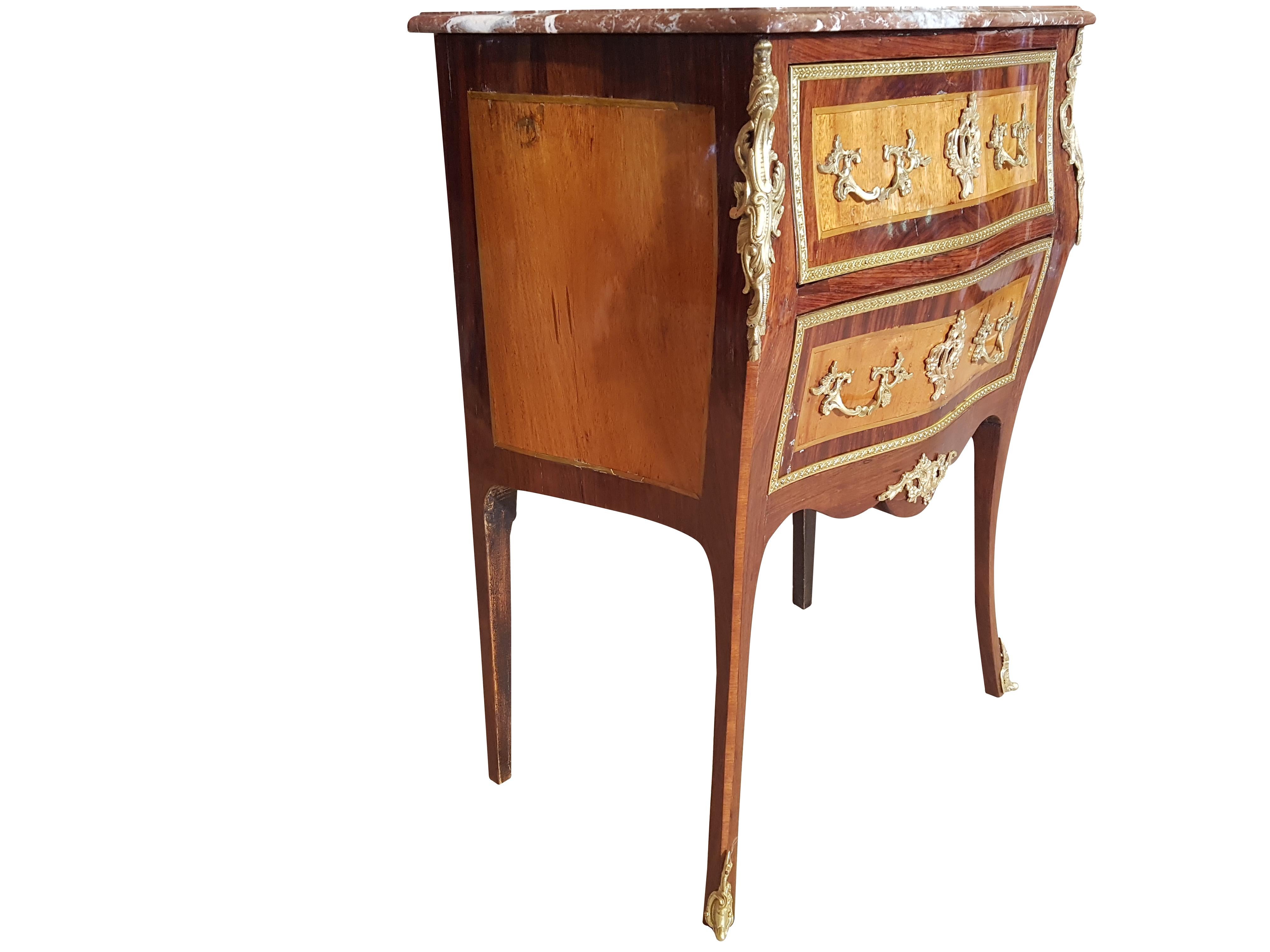 This rare, small commode from France manufactured in the second half of the 19th century, was carefully restored preserving the patina, missing keys were made, the shellac surface was renewed and polished and missing brass strips were renewed. The