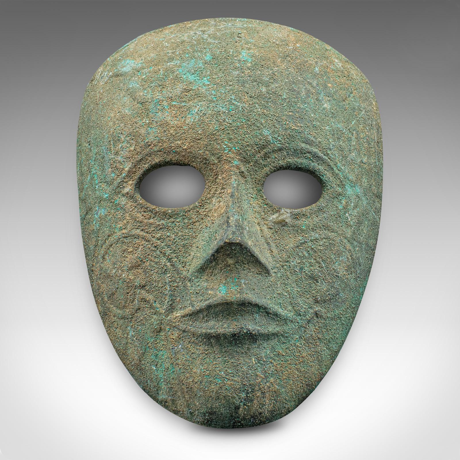 This is a small antique decorative mask. A Continental, weathered bronze mask with Eastern overtones, dating to the Georgian period, circa 1800.

Fascinating bronze mask with appealing weathering
Displays a desirable aged patina in good original