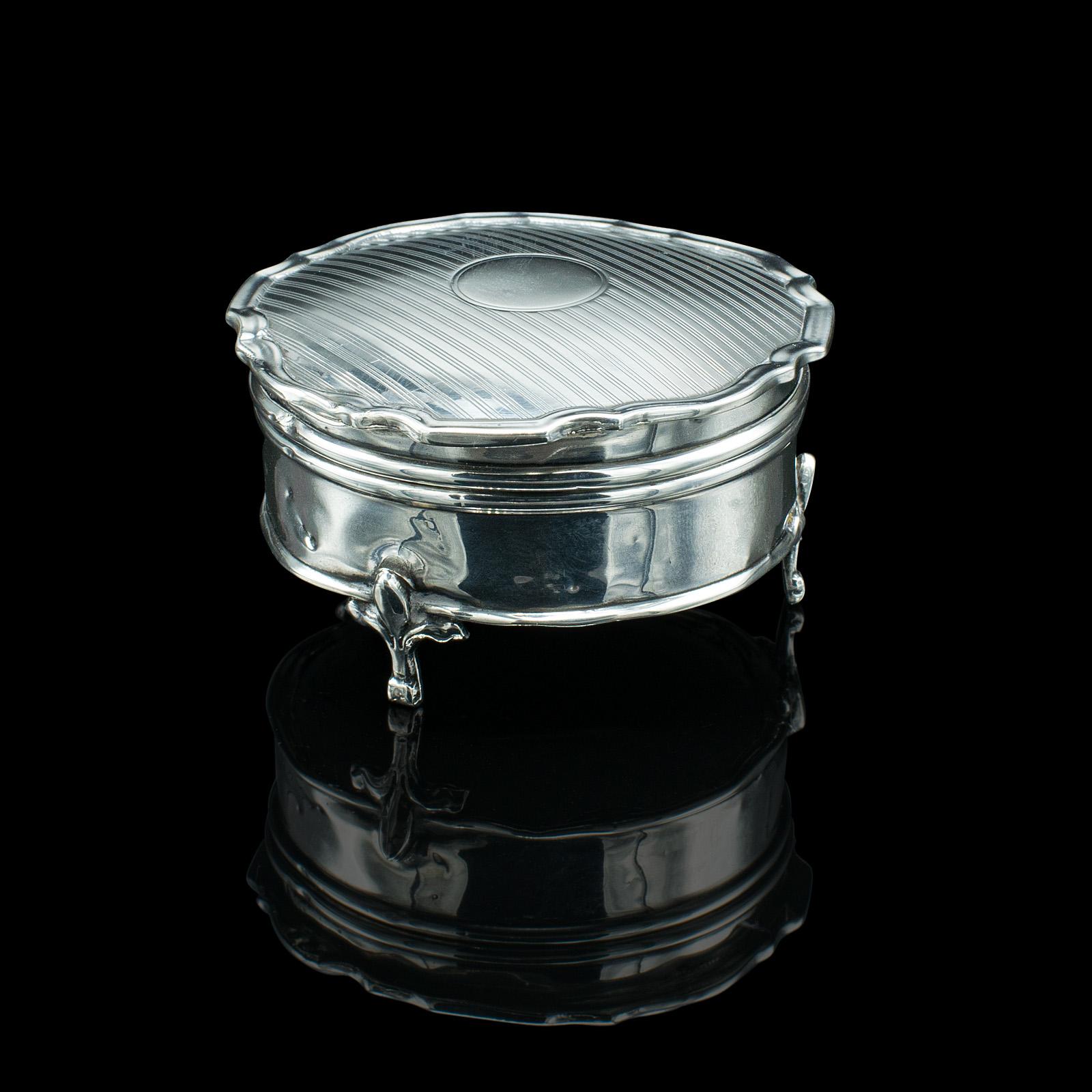 This is a small antique dressing table ring box. An English, Sterling silver lidded dish, dating to the early 20th century, hallmarked 1921.
 
Enclose precious rings in this delightful overnight ring box
Displays a desirable aged patina and in good