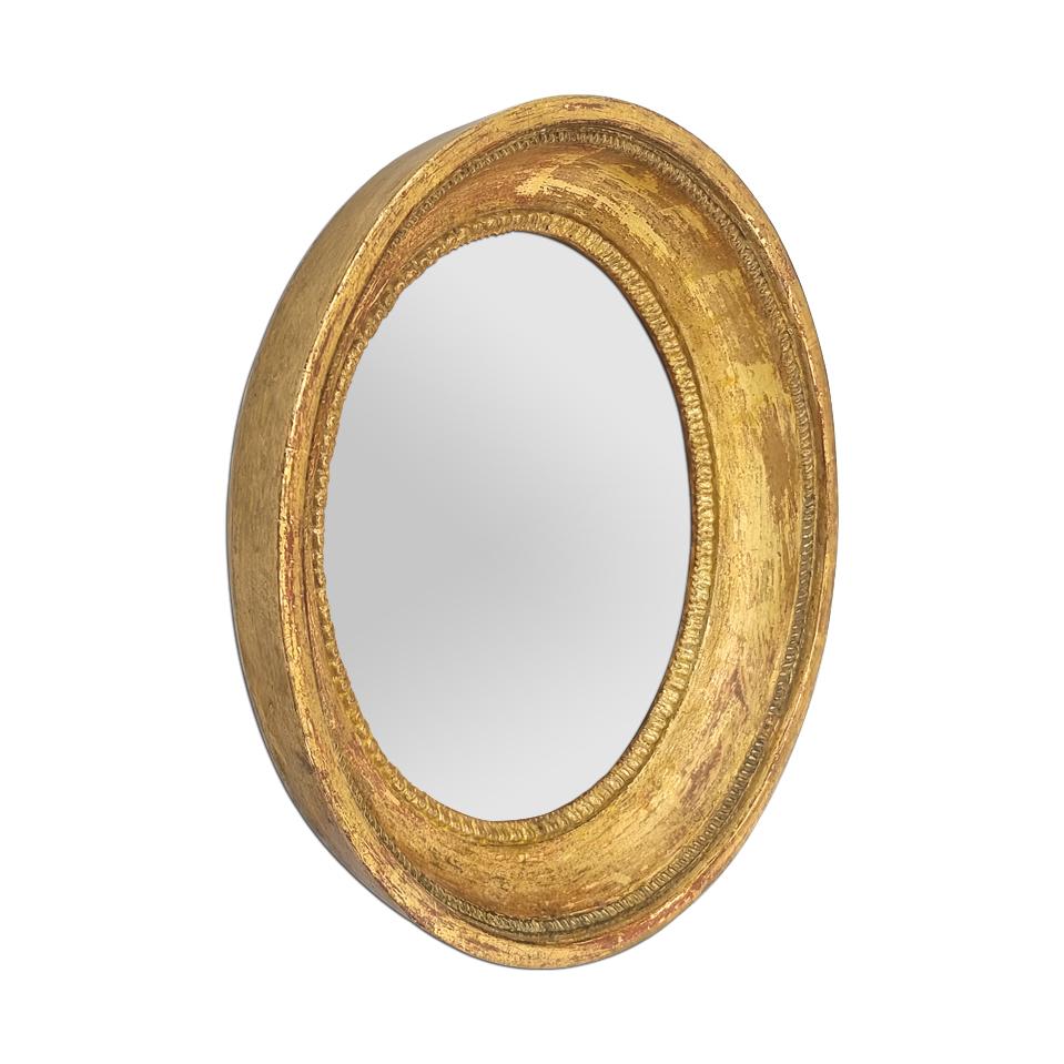 Petit miroir ovale en bois doré de style Louis XVI, vers 1860. Orné de 