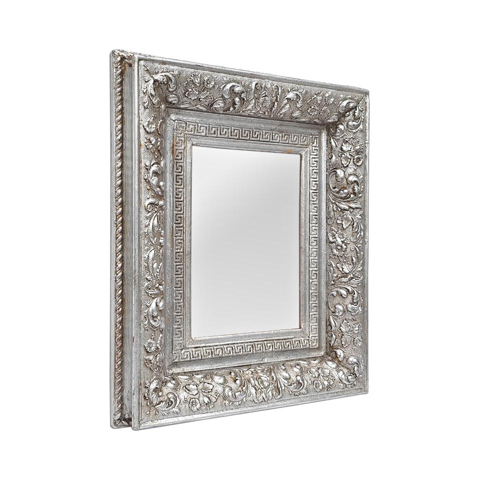 Small French antique mirror from the early 20th century, circa 1900, silvered and patinated, decorated with Greek frieze and scrolls of stylized flowers and leaves. Antique frame re-silvered with leaf. Frame width: 7 cm / 2.75 in. Modern glass