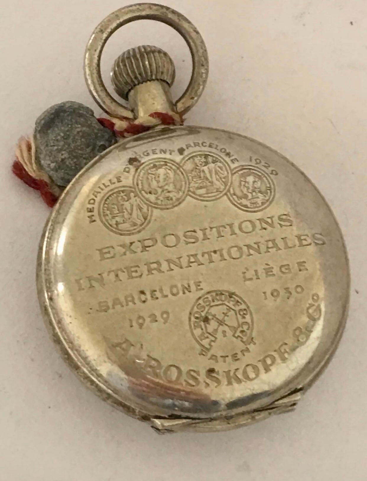 Small antique Full Hunter A. Rosskopf & Co. Pocket Watch For Spares Or Repair.

This lovely watch is working and running well. The back cover doesn’t close, front glass is missing, and visible tore / cracks on the middle on the dial as