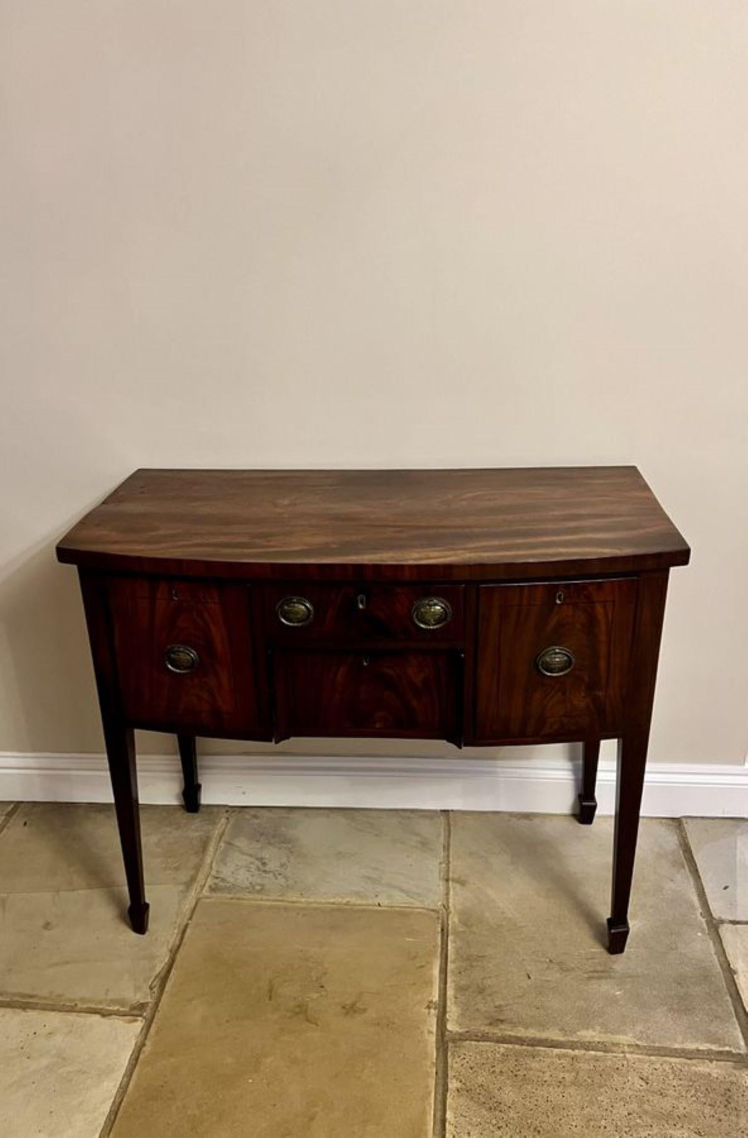 Small antique George III quality mahogany bow fronted sideboard having a quality mahogany bow fronted top, above four drawers with the original handles, standing on square tapering legs with spade feet.

D. 1800