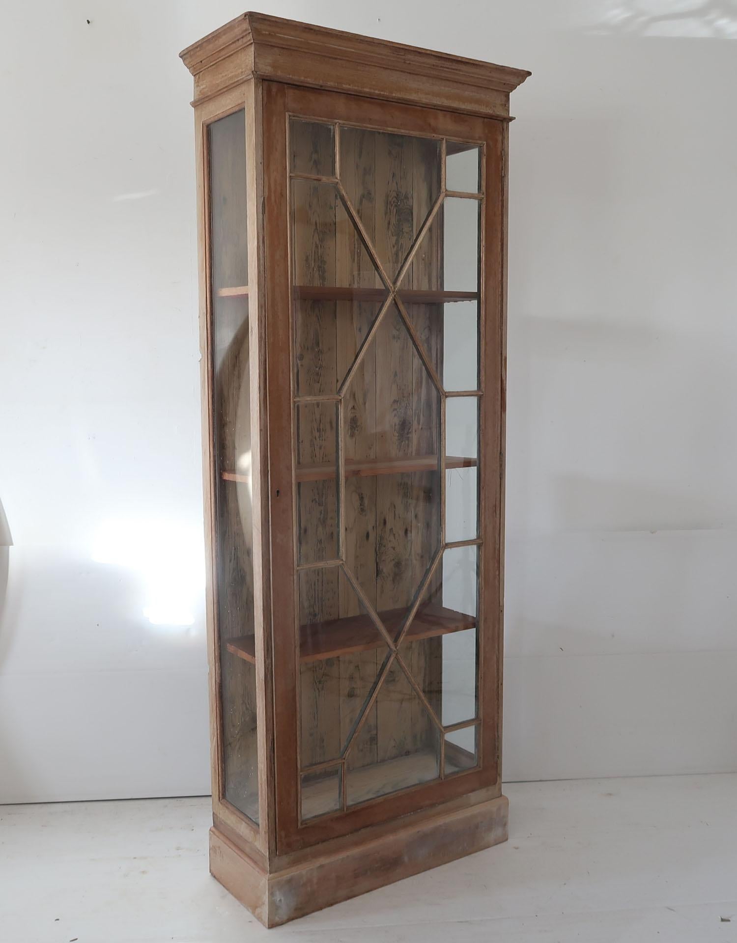Fabulous small bleached mahogany and pine cabinet

I particularly like the simplicity of this piece and the original bubbly glass in the door and sides.

The measurement given is the cornice size.

It has a key.