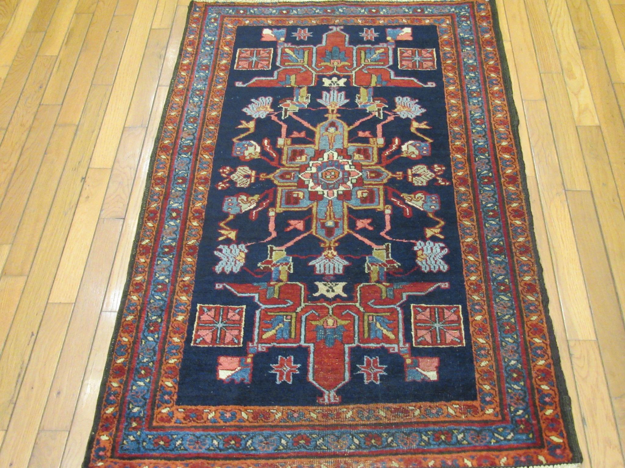 This is a small hand-knotted antique Persian Heriz rug. It is made with wool pile and cotton foundation and natural dyes in a geometric design. It is a perfect rug for any spot in your house or office. It measures 2' 10'' x 4' 7'' and in great