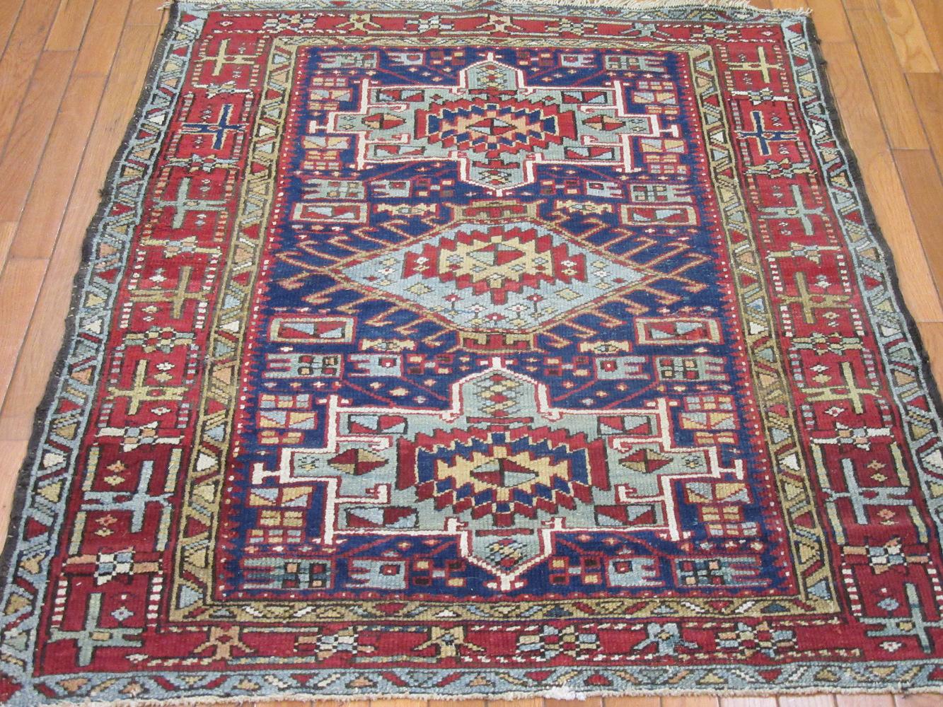 This is a small hand-knotted antique Persian Heriz rug. It is made with wool pile and cotton foundation and natural dyes in a geometric multi medallion design. It a perfect rug for any spot in your house or office. It measures
Measures: 3'5