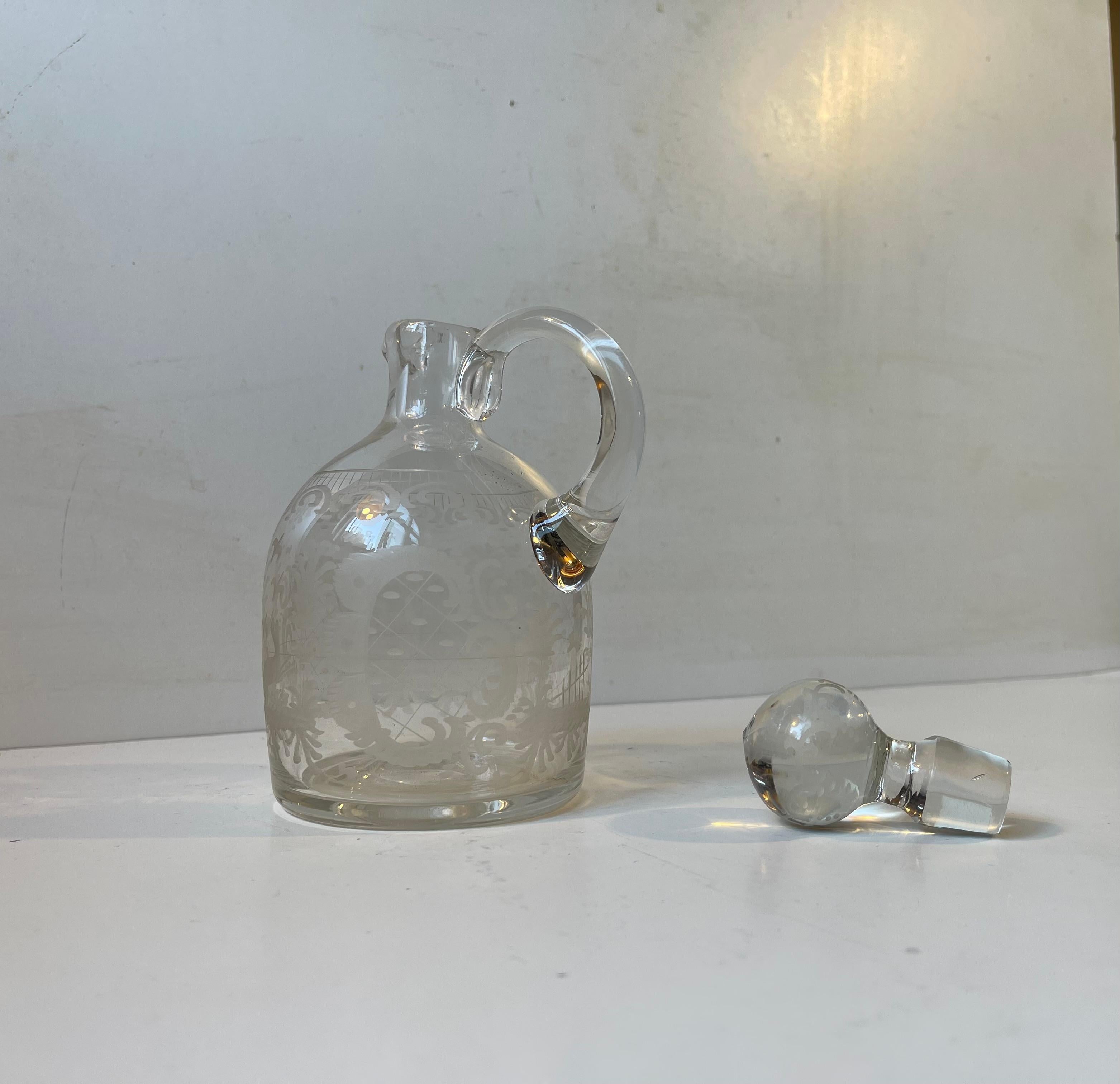 Small Hand-blown Port Wine decanter in clear glass decorated with etchings to its body and stopper. Made at Holmegaard/Kastrup in Denmark circa 1900-1920. Measurements: H: 18 cm, Diameter: 10 cm, Capacity: 0,5 liter.

Free World wide shipping.