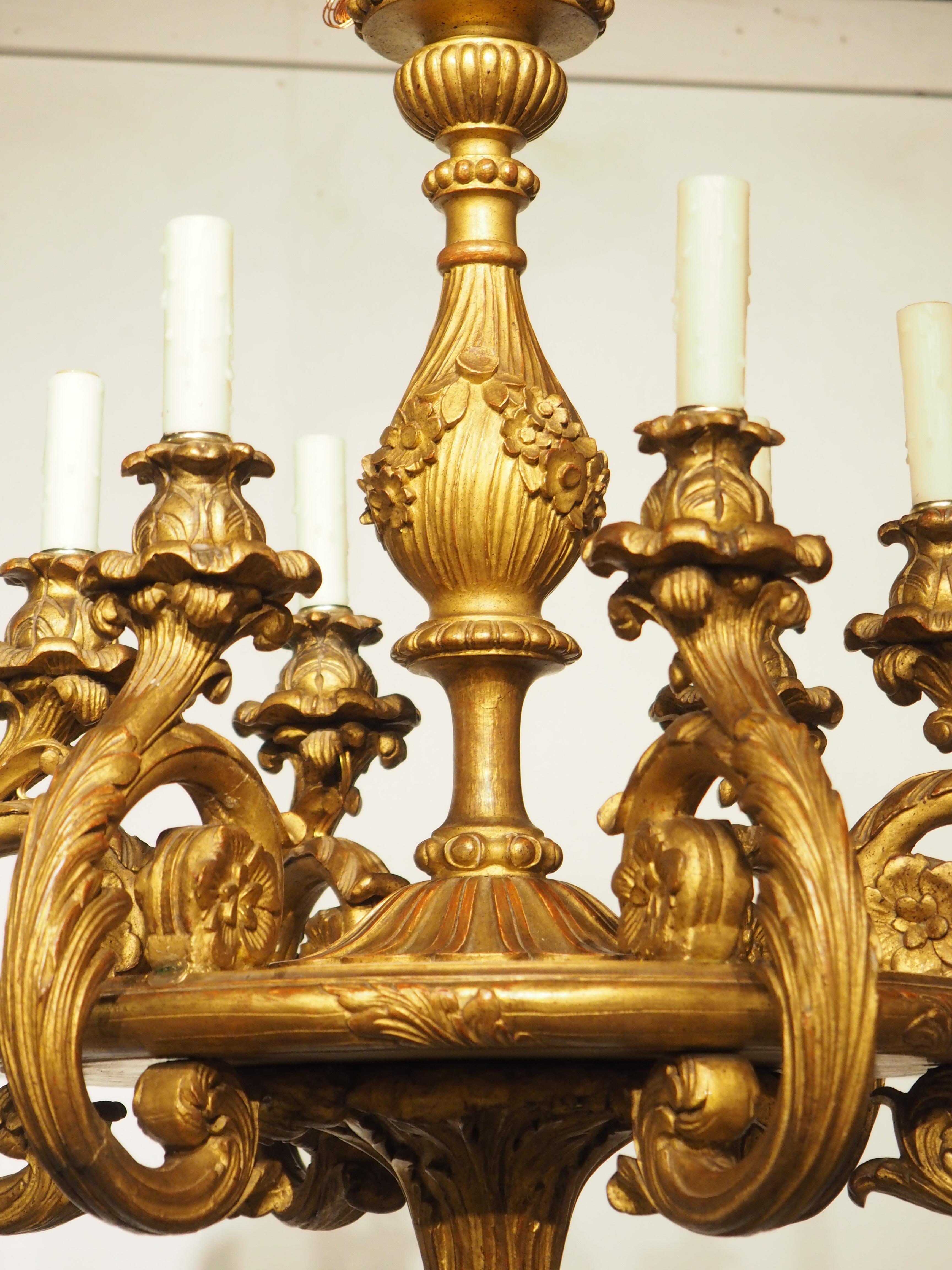 The perfect illumination source for a more intimate setting, this small six-light chandelier was hand-carved in Italy, circa 1860. Six foliate arms originate on the underside of the circular main body, curling upwards before terminating in a floret