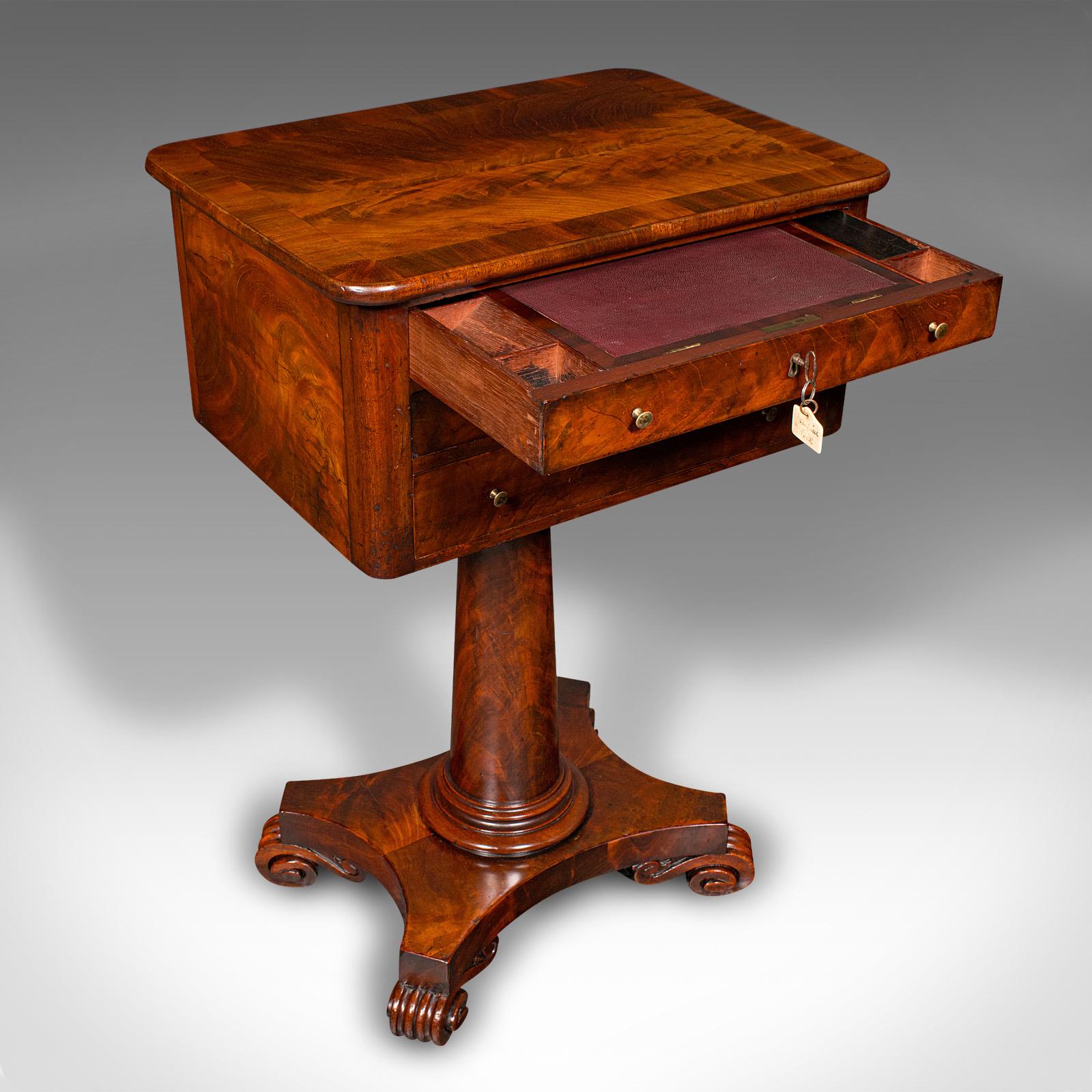 This is a small antique ladies correspondence table. An English, flame mahogany writing table, dating to the William IV period, circa 1835.

Fine suite of functions and storage across an appealing, compact form
Displays a desirable aged patina and