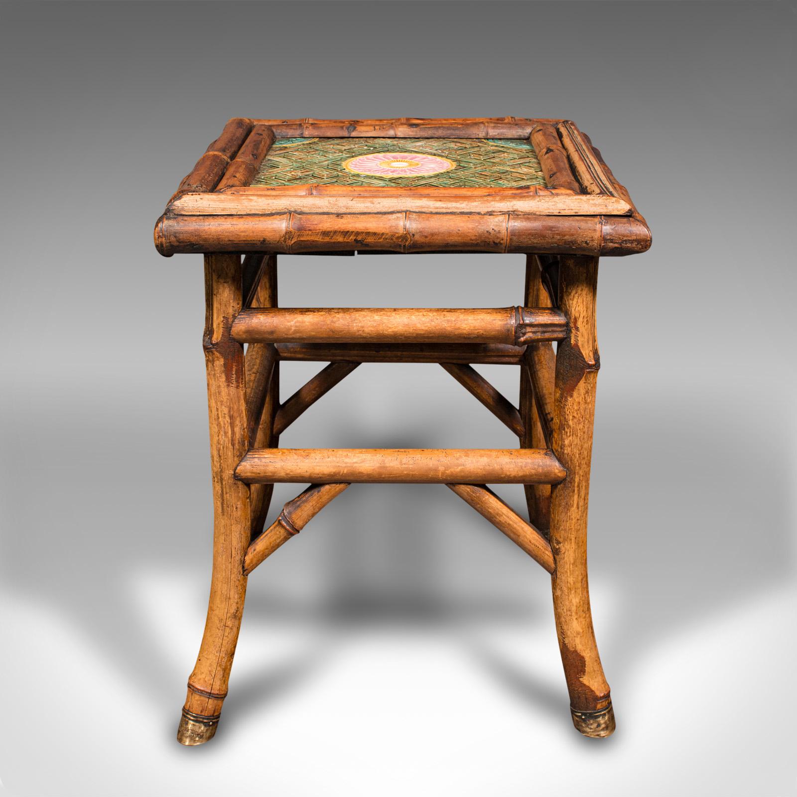 This is a small antique lamp table. An English, bamboo and ceramic tile side table by WF Needham, dating to the late Victorian period, circa 1900.

Delightfully petite, late Victorian table with charming tiled top
Displays a desirable aged patina