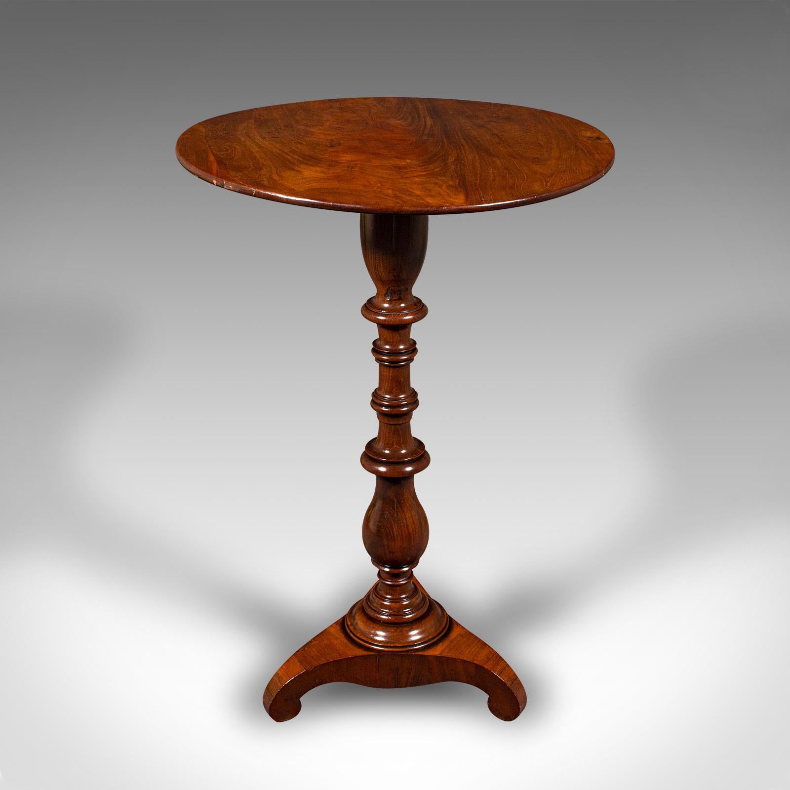 This is a small antique lamp table. An English, flame mahogany wine tripod table, dating to the Regency period, circa 1820.

Charmingly petite table with fine figuring and colour
Displays a desirable aged patina and in good order
Select flame stocks