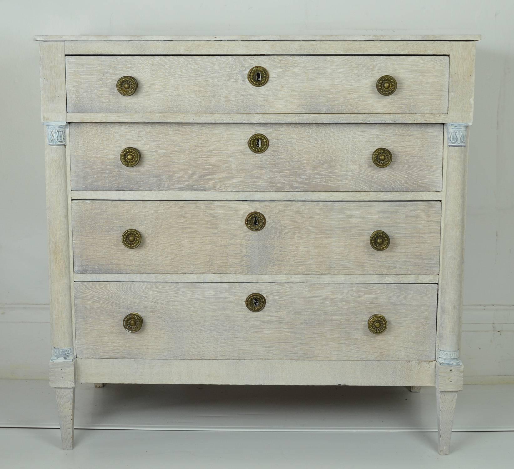 Charming limed oak commode or chest of drawers.

Provincial French in Directoire taste, early 19th century.

Wonderful simple lines. Half round column detail on the sides of the front.

Original gilt brass hardware.

Original almost