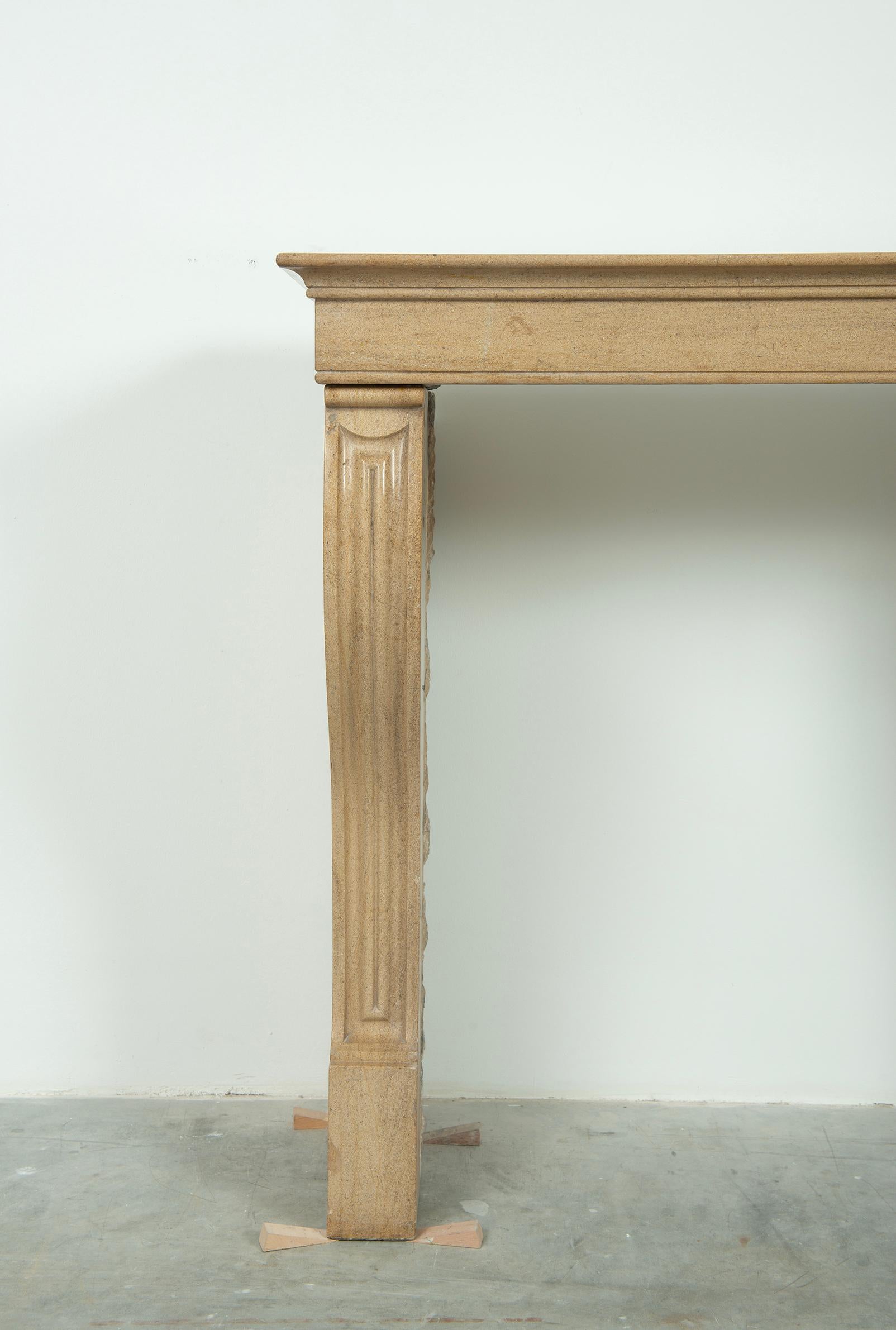 French Small Antique Limestone Fireplace Mantel from France For Sale