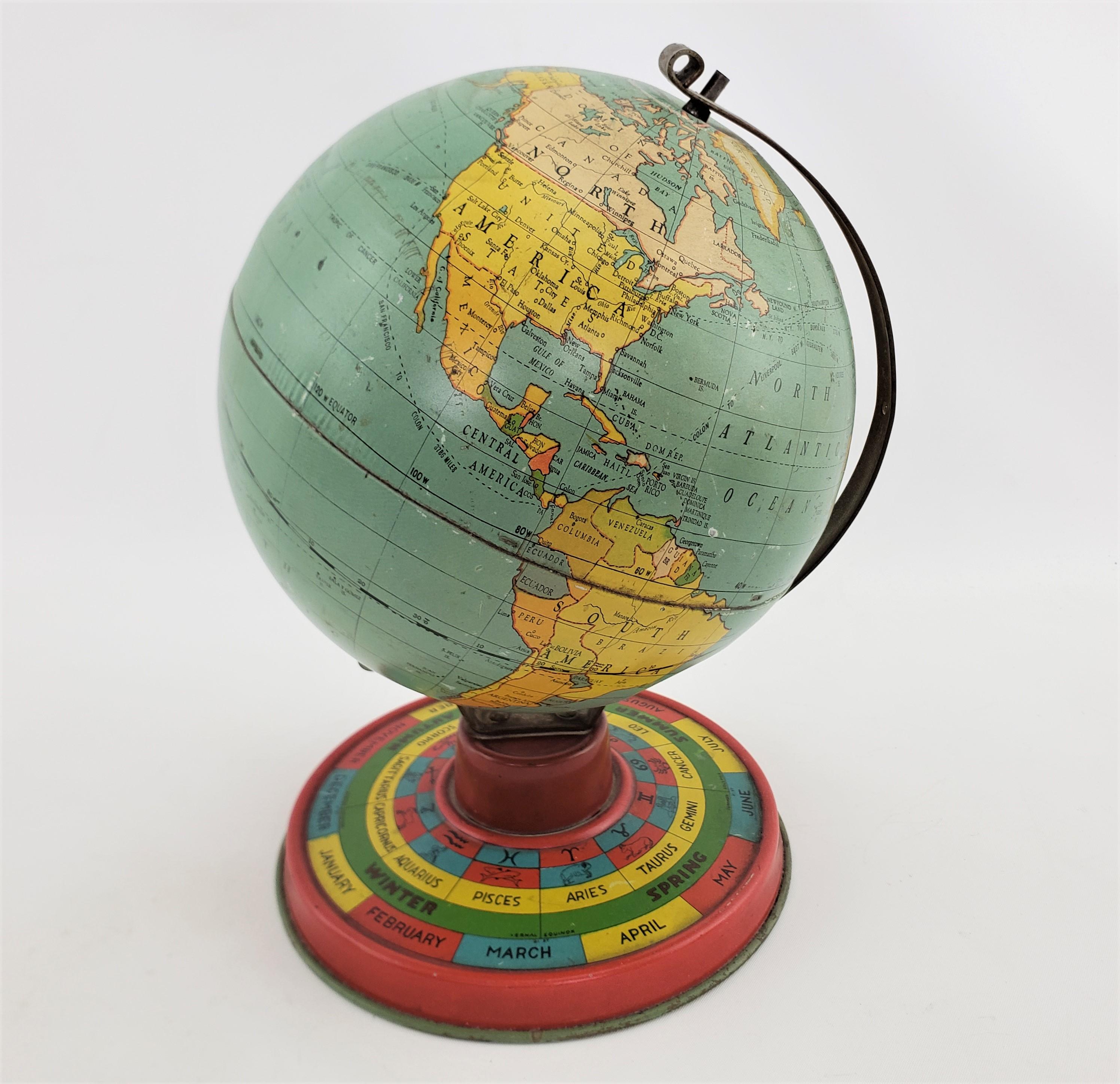 Art déco Petit globe terrestre ancien de bureau ou de table en métal surdimensionné avec base lithographiée