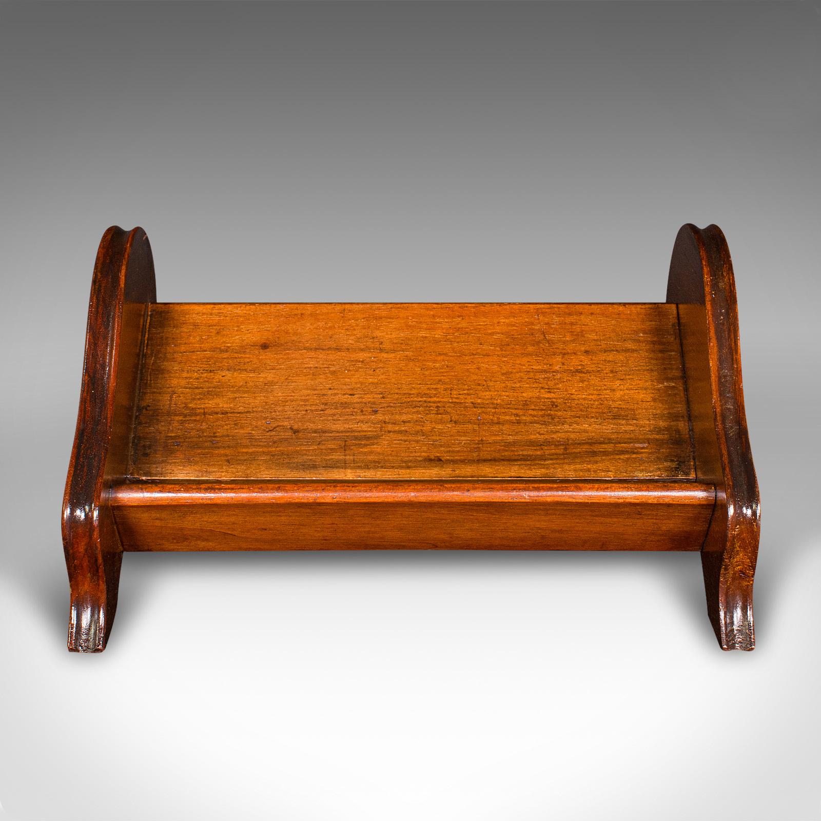 
This is a small antique novel rest. An English, mahogany book trough, dating to the Edwardian period, circa 1910.

Charmingly petite for a selection of favourite titles
Displaying a desirable aged patina and in good order
Select stocks shows fine