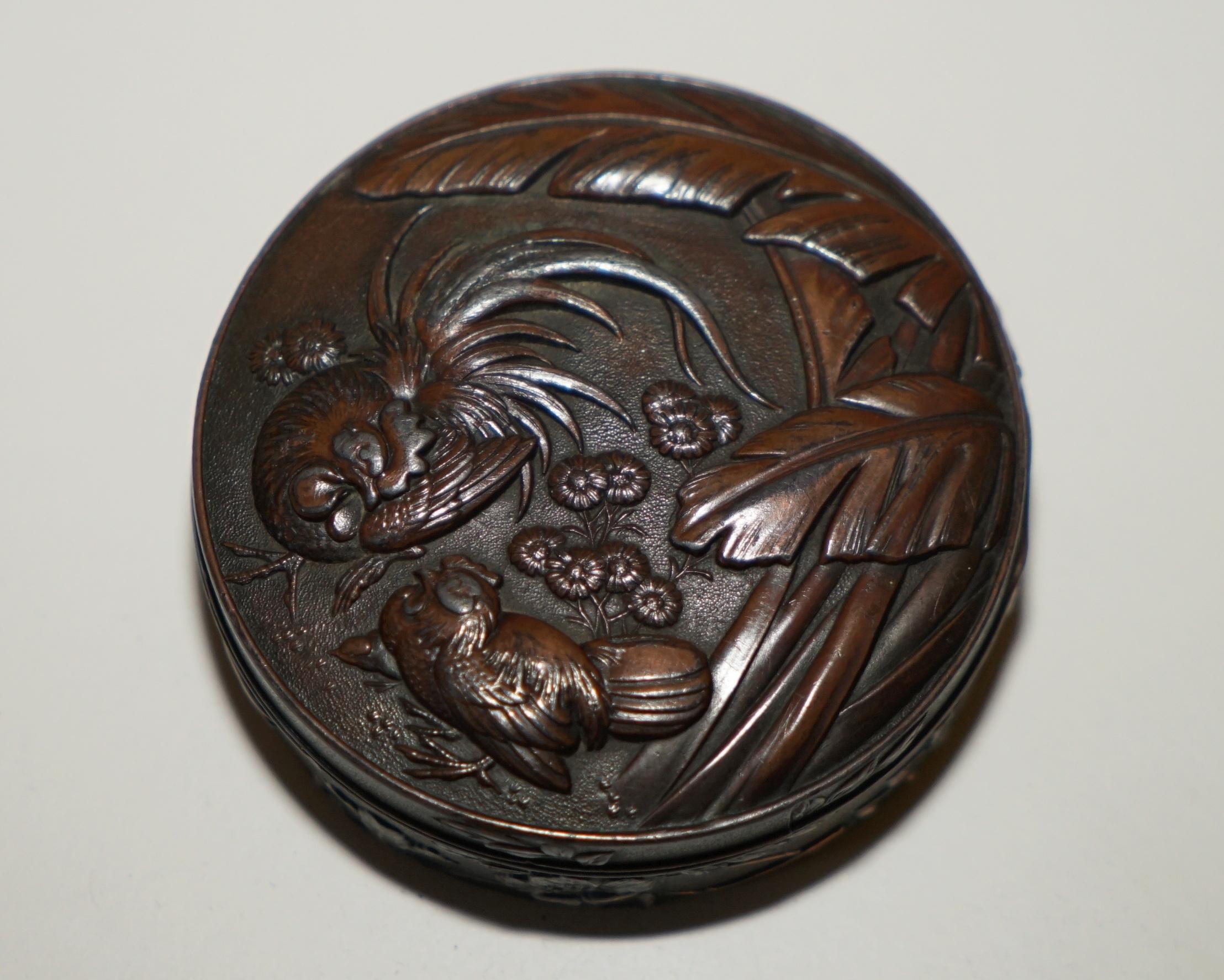 Royal House Antiques

Royal House Antiques is delighted to offer for sale this lovely small antique circa 1900-1920 bronzed and copper Oriental Jewelry trinket box with Repoussé top depicting chickens 

A good looking and decorative little box, it