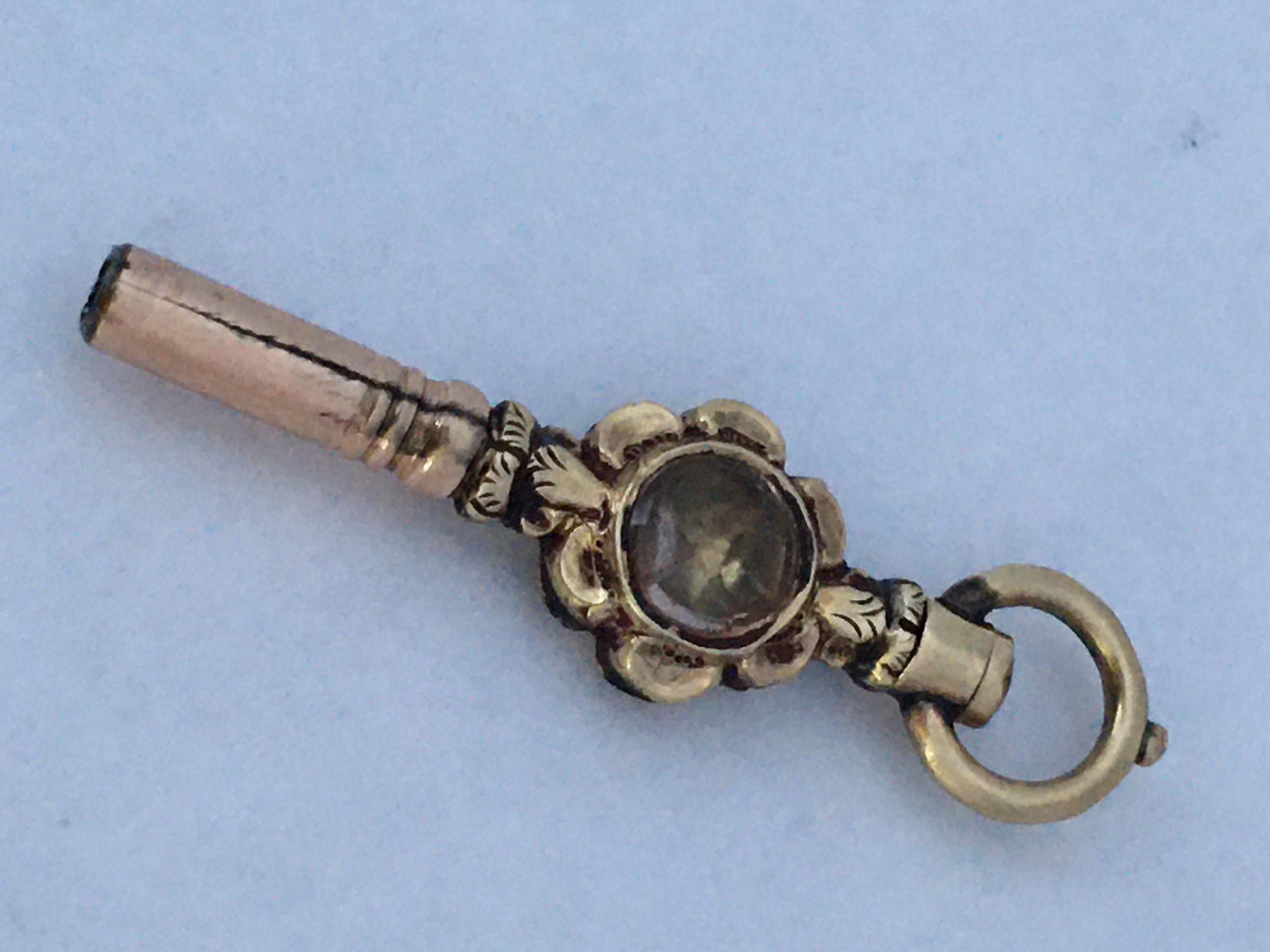 This beautiful and small antique pocket watch key with a clear white and green paste is measured 31mm from the loop to the bottom. It is a pre-owned condition as shown. 

Please study the images carefully as form part of the description.