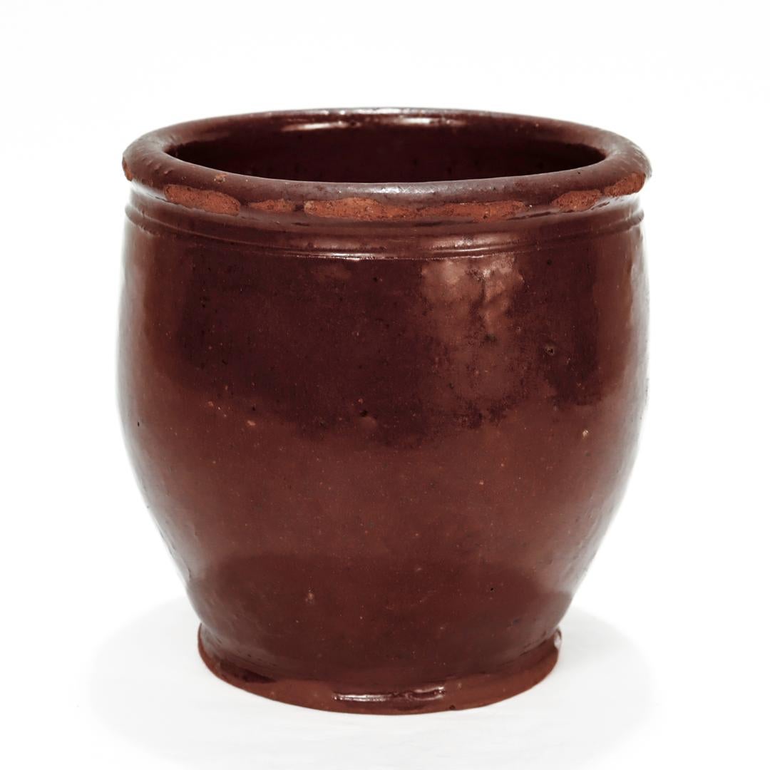 A fine antique redware flowerpot.

Found in Virginia (likely Mid-Atlantic in origin).

Simply a wonderful folky piece of Americana!

Date:
Late 18th or Early 19th Century

Overall Condition:
It is in overall good, as-pictured, used estate condition