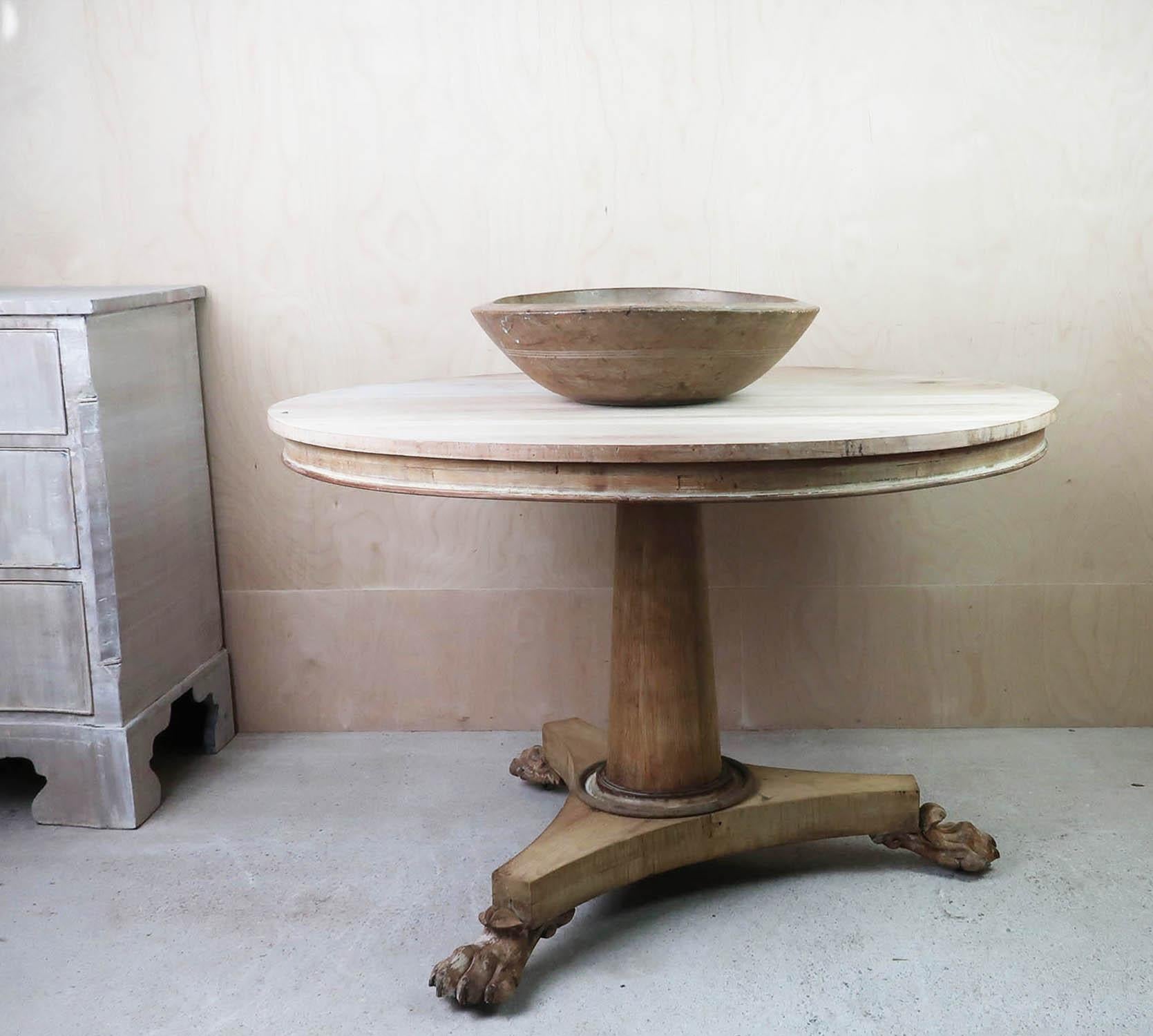 Fabulous small round table. Made from bleached tropical hardwood and pine

Nicely figured top

Amazing carved lion paw feet

I particularly like its simplicity.

I have chosen not to lacquer or wax the table.

2 original casters. One