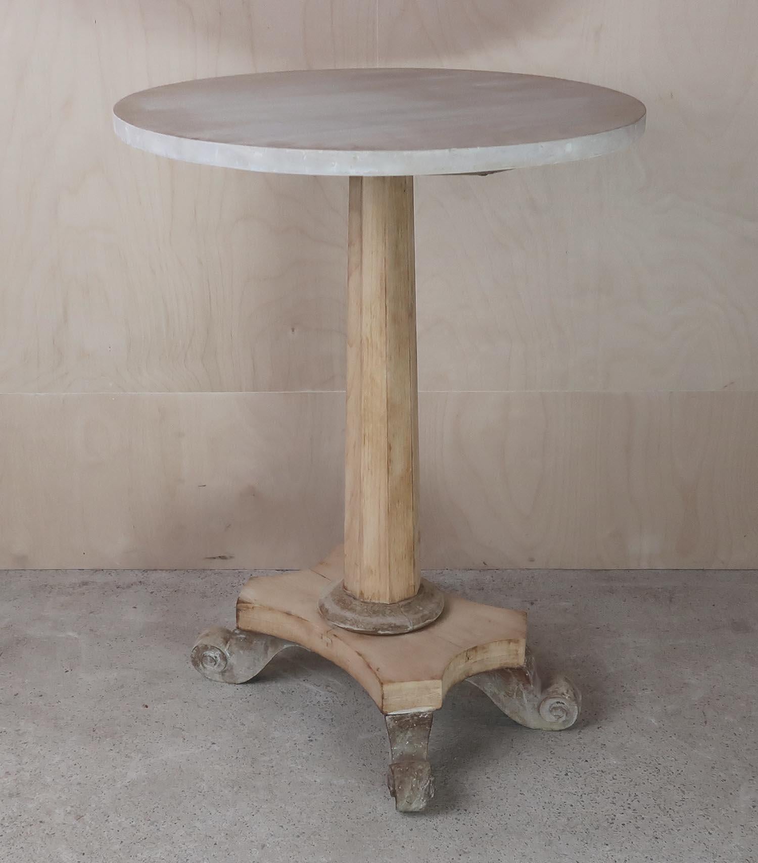 Elegant small round table. Made from bleached tropical hardwood and pine

I particularly like its simplicity and the scroll feet.

The top is old but it is a replacement

I have chosen not to lacquer or wax the table.

Sturdy