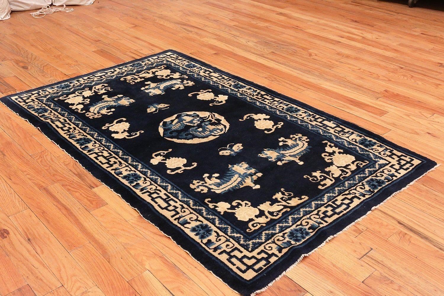 Beautiful midnight blue background small size antique Peking foo dog Chinese rug, country of origin or rugs type: Antique rugs from China, date circa turn of the 20th century. Size: 4 ft 1 in x 6 ft 6 in (1.24 m x 1.98 m)

This intriguing and