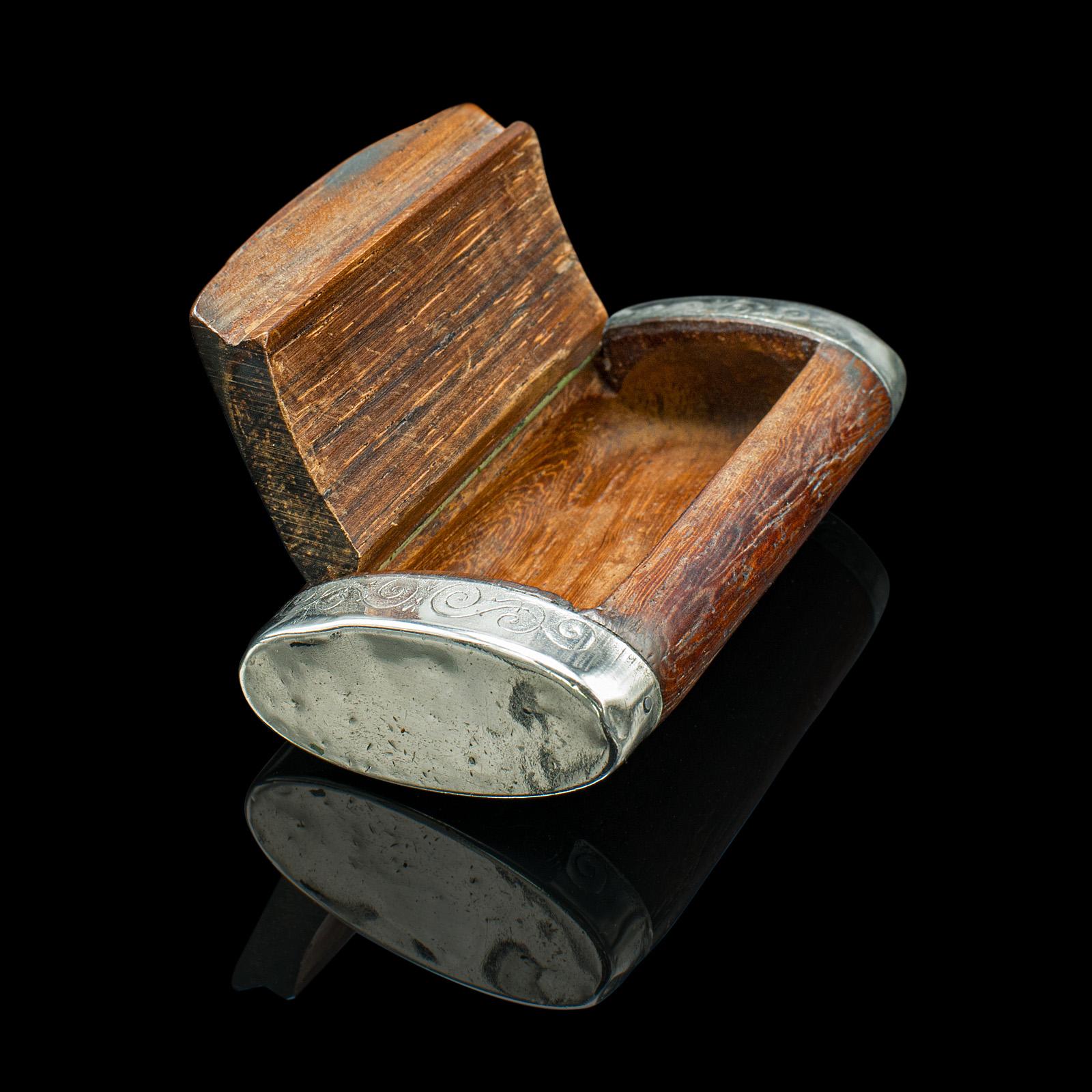 This is a small antique pill box. A French, walnut and silver plated lidded pocket case, dating to the late Victorian period, circa 1900.

Charmingly petite wooden box, ideal for the coat pocket
Displays a desirable aged patina and in good