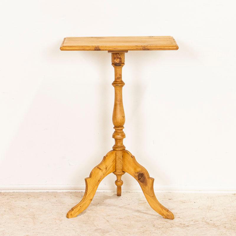The small rectangular pine top is balanced by the turned pedestal base resting on three 