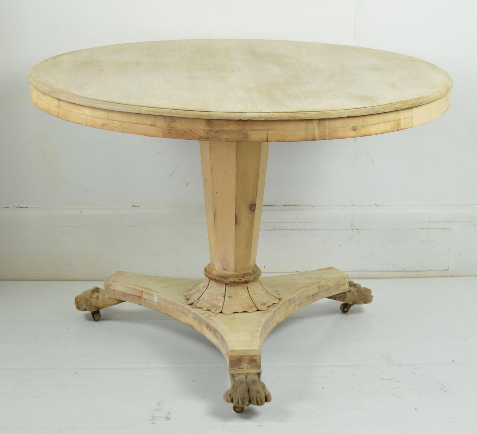 Fabulous small round table. Made from bleached Honduras mahogany and pine

I particularly like the simplicity of this table and the petal shaped detail at the base of the pedestal support.

Beautifully figured top. Lion paw feet.

Replacement