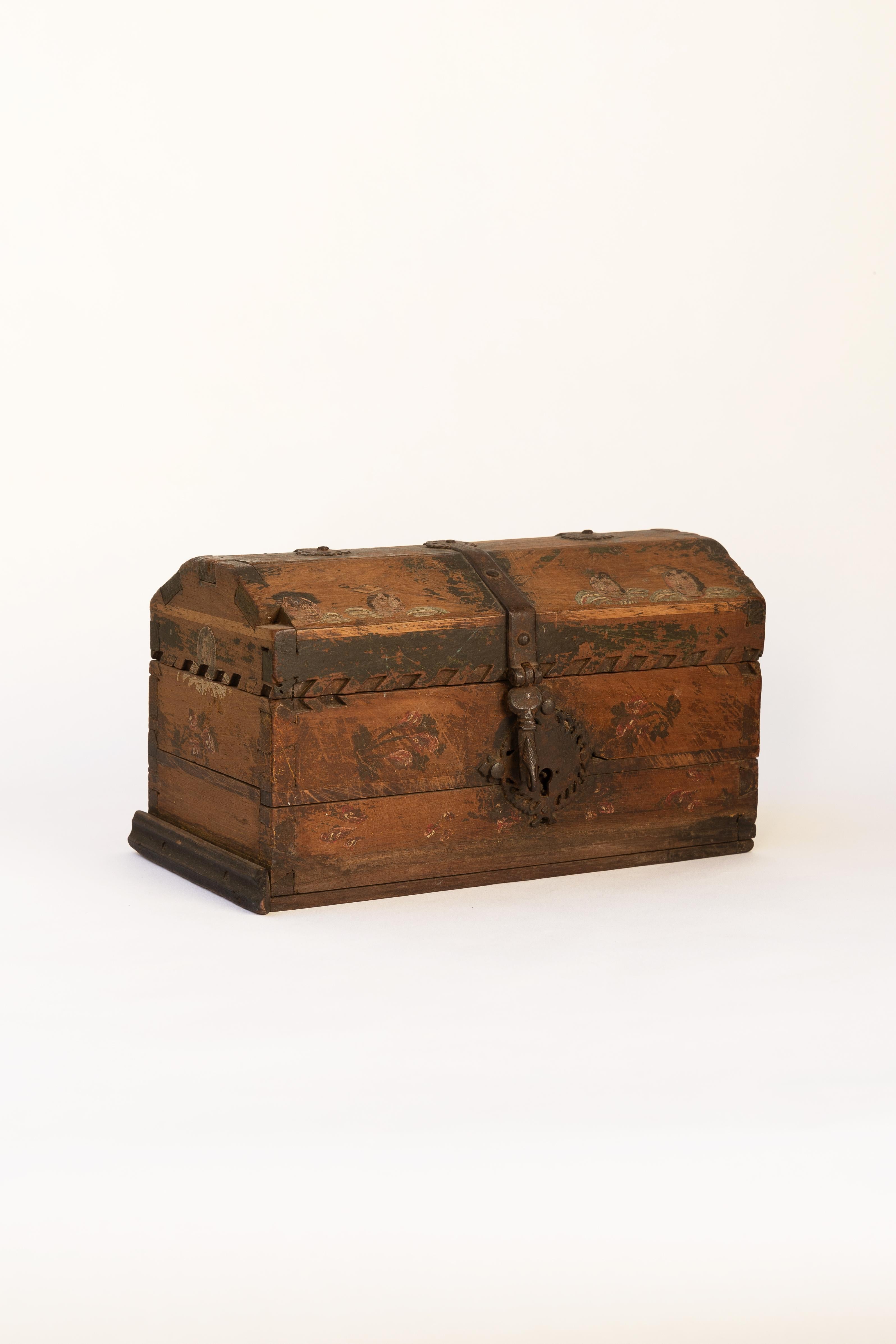 Small Antique Spanish Colonial Chest, Late 1700’s
Small colonial chest made of mesquite wood with remnants of paint. Assembled with dovetail joints and featuring impressive wrought iron work. Beautiful patina acquired over the centuries, in very