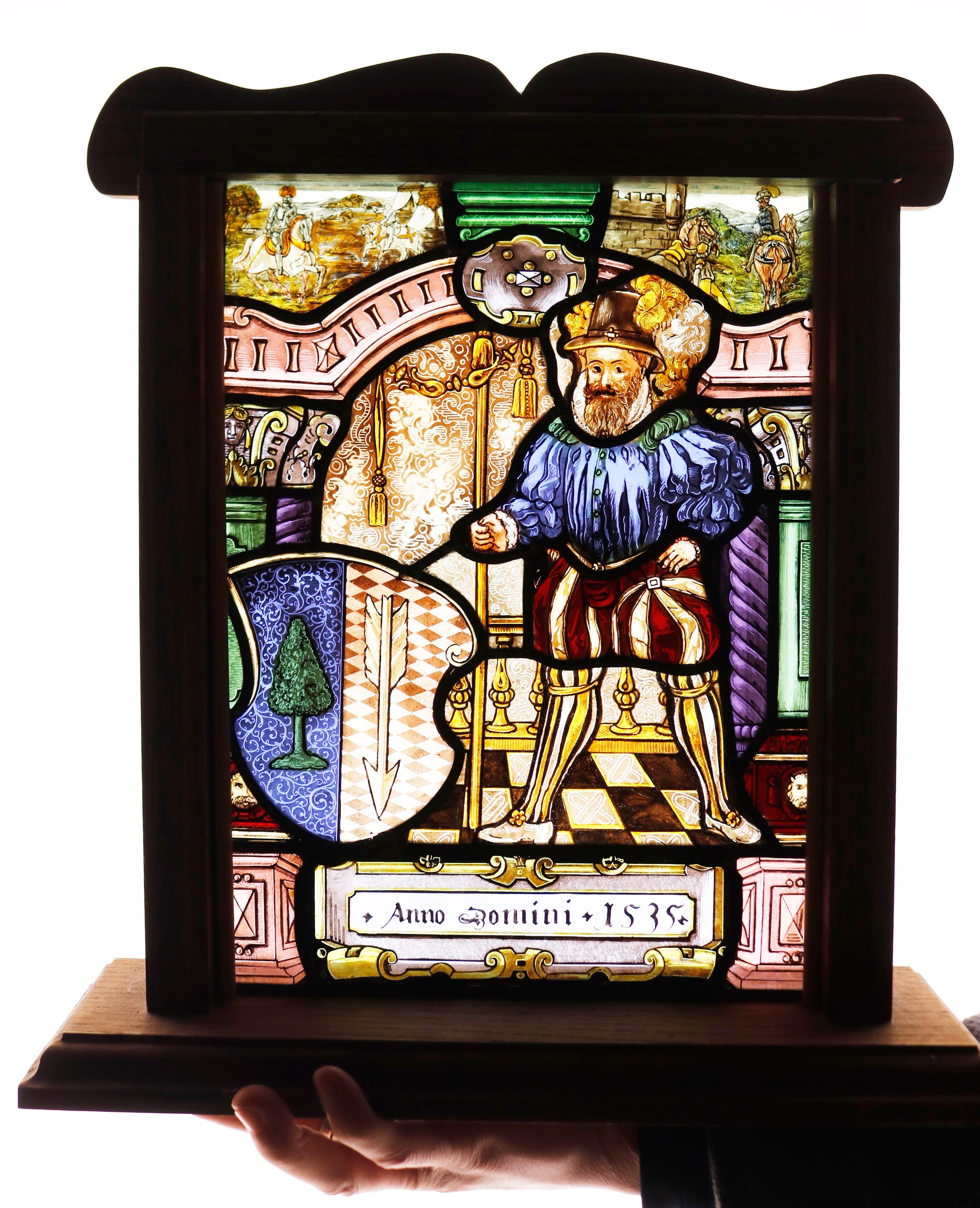 Small Stained Glass Window Panel. A Tudor styled, painted stained glass window.
The piece is dated 1535 but is likely to have been produced in the early 20th century, circa 1920. The stained glass is beautifully vibrant and rich in colour with lots