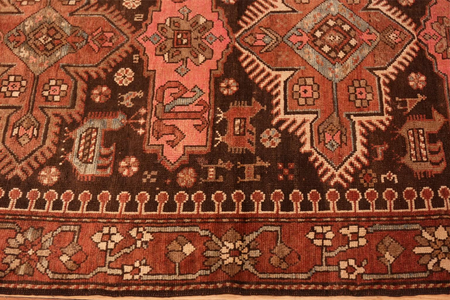 Small antique Tribal Caucasian Kazak rug, country of origin: Caucasus, Date circa 1900 - Size: 4 ft x 8 ft (1.22 m x 2.44 m). True to its traditional Caucasian roots, this brilliant Kazak rug features a variety of elegant angular elements. Vibrant