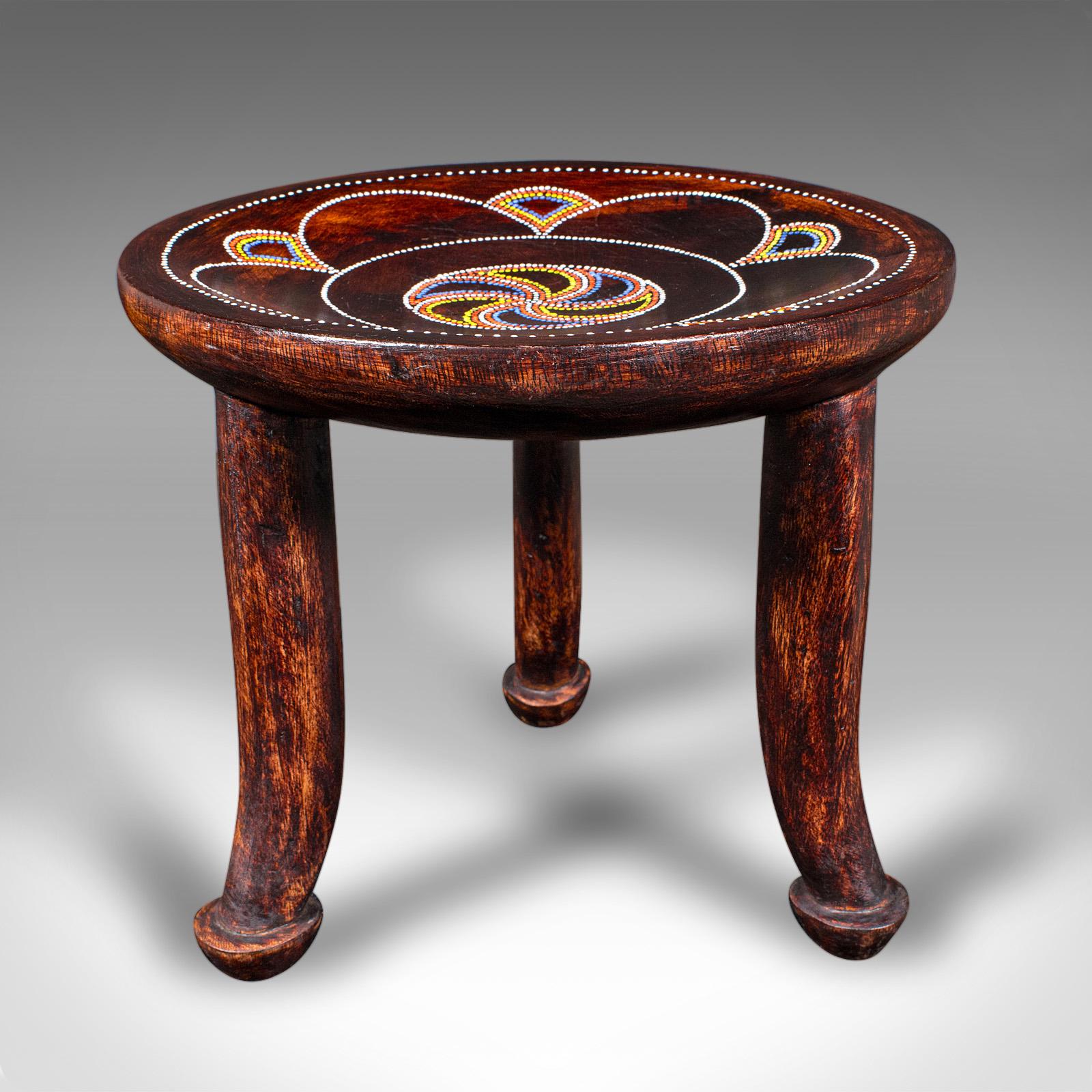 This is a small antique tribal side table. An African, fruitwood lamp table or stool, dating to the late Victorian period, circa 1900. Exhibiting naive indigenous charm, this decorative piece is redolent of the Luo tribe of Kenya, known for their