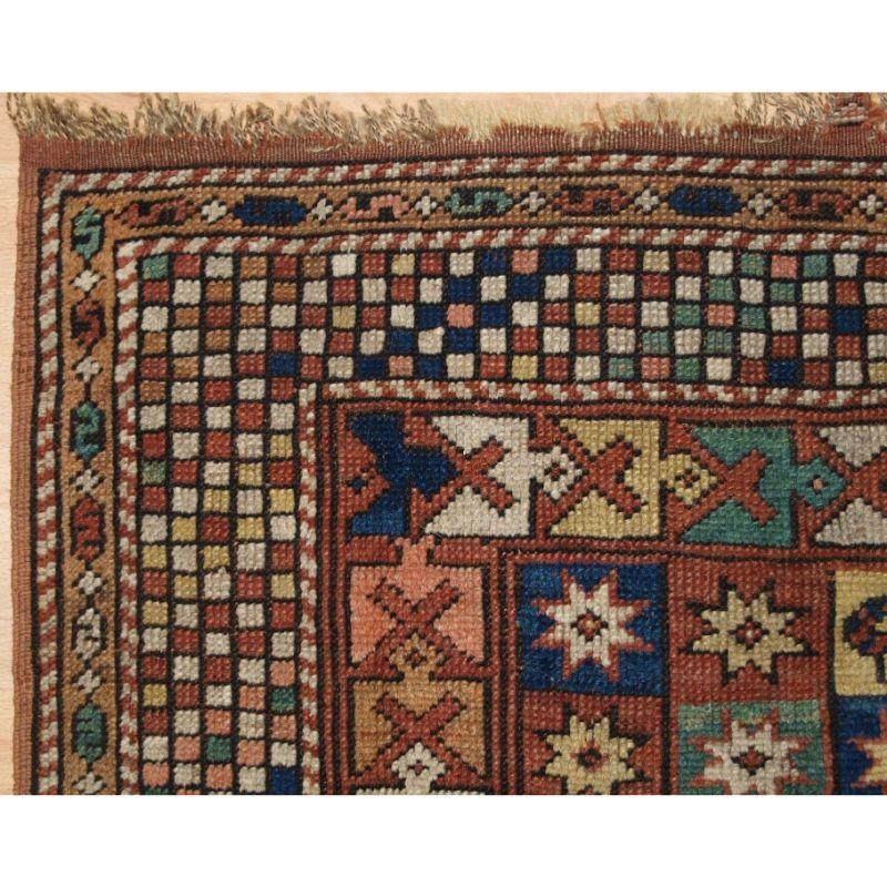 Antique Turkish Bergama rug of small square size, the rug has an interesting checker board design with squares containing stars and two birds.

The border is of a fine checker board design giving the rug a very contemporary feel.

The rug