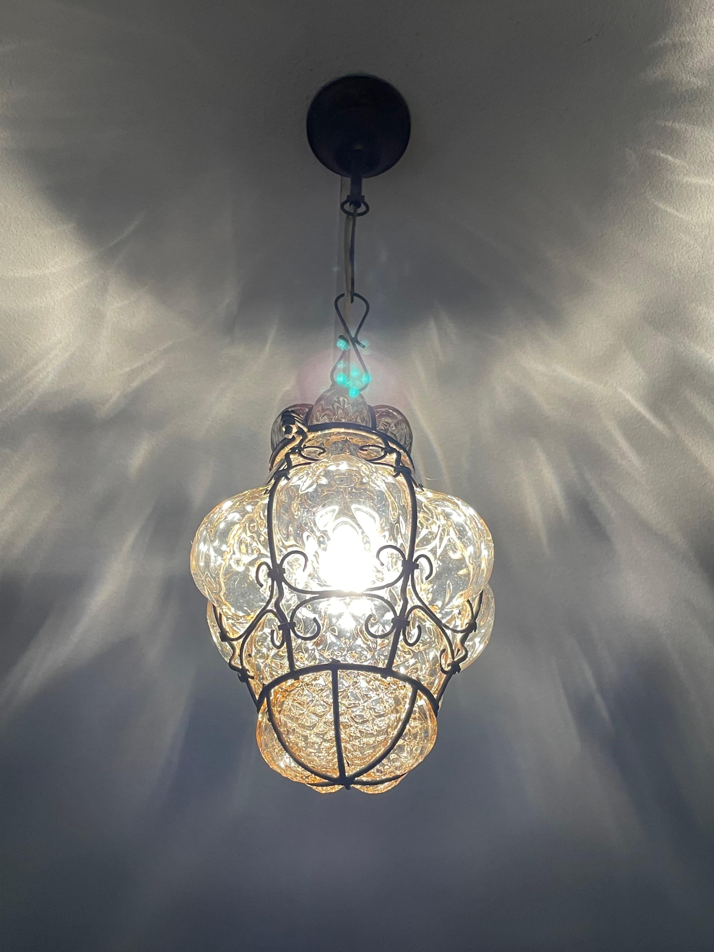 One of the smallest ever, Venetian mouth blown glass pendants.

This adorable and antique Venetian pendant light is one of the smallest of its kind that we ever had the pleasure of offering. When it comes to condition, style and true workmanship