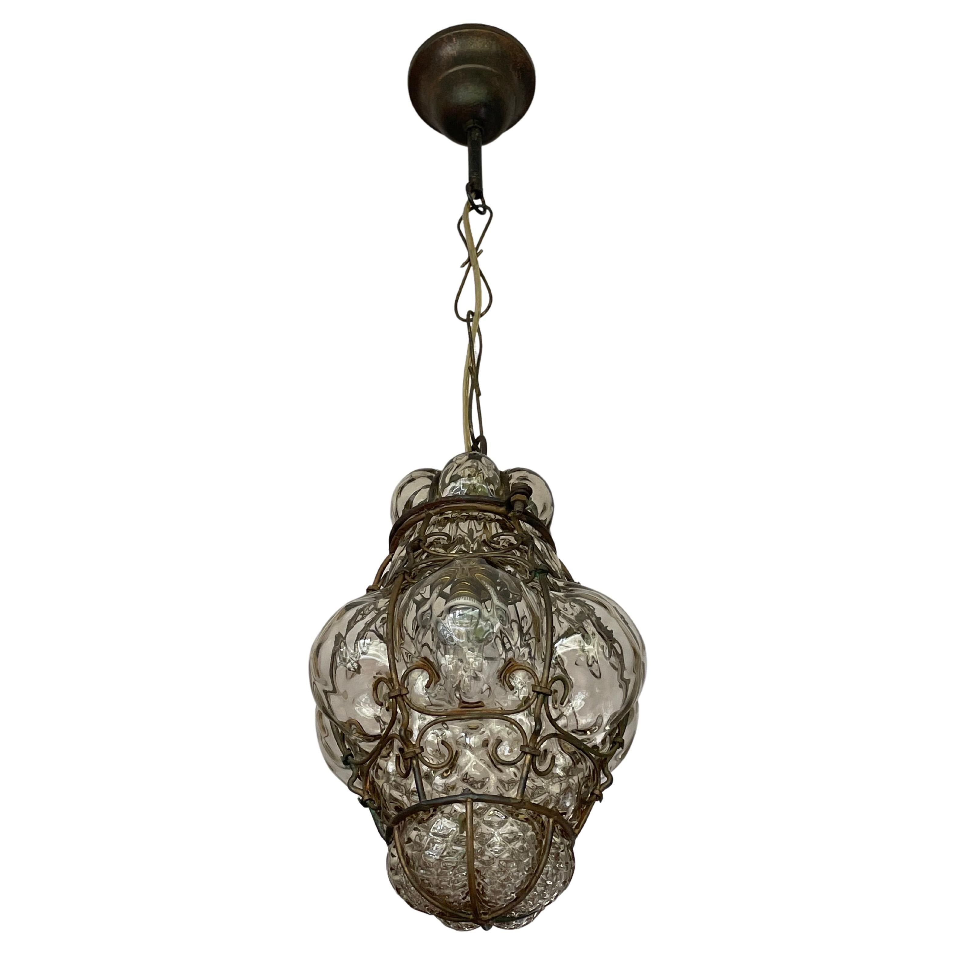 Small Antique Venetian Murano Pendant, Glass Mouth Blown into Wrought Iron Frame For Sale