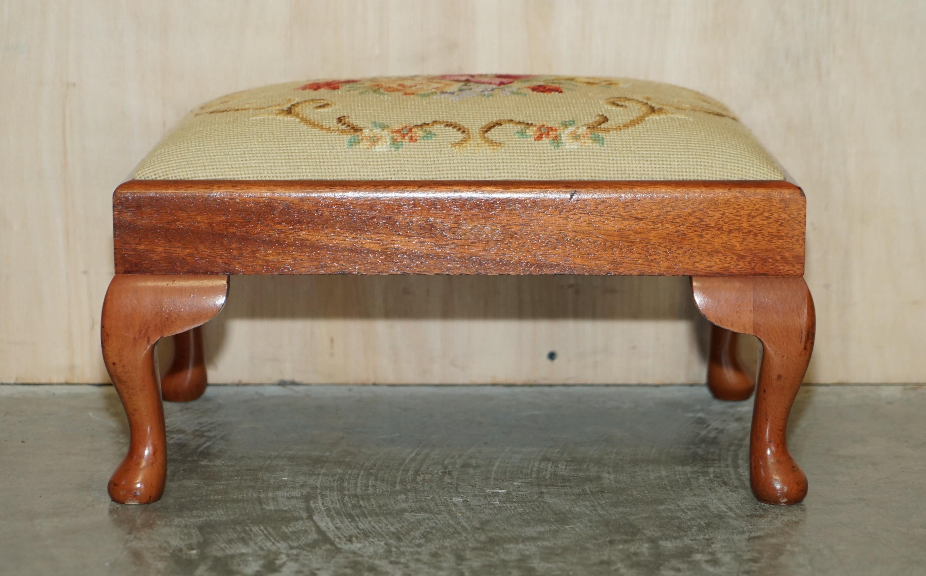We are delighted to offer for sale this lovely original Victorian circa 1880 hand carved walnut Cabriolet legged footstool with floral embroidered upholstery 

A very decorative and well made piece, the top has a period Victorian embroidery of