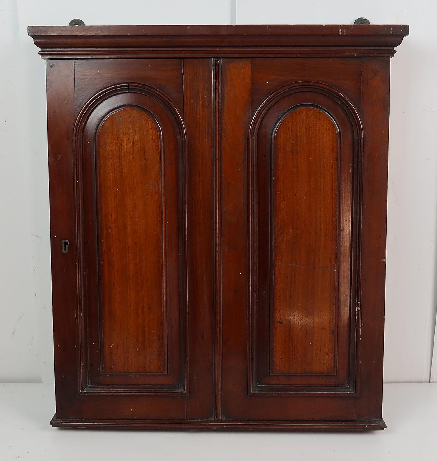 Fabulous small Housekeepers cupboard or key cabinet

Two arched panels on one door.

Made from tropical hardwood. Lovely colour.

Missing the lock.






Beautifully figured mahogany particularly on the top and drawer front

Single