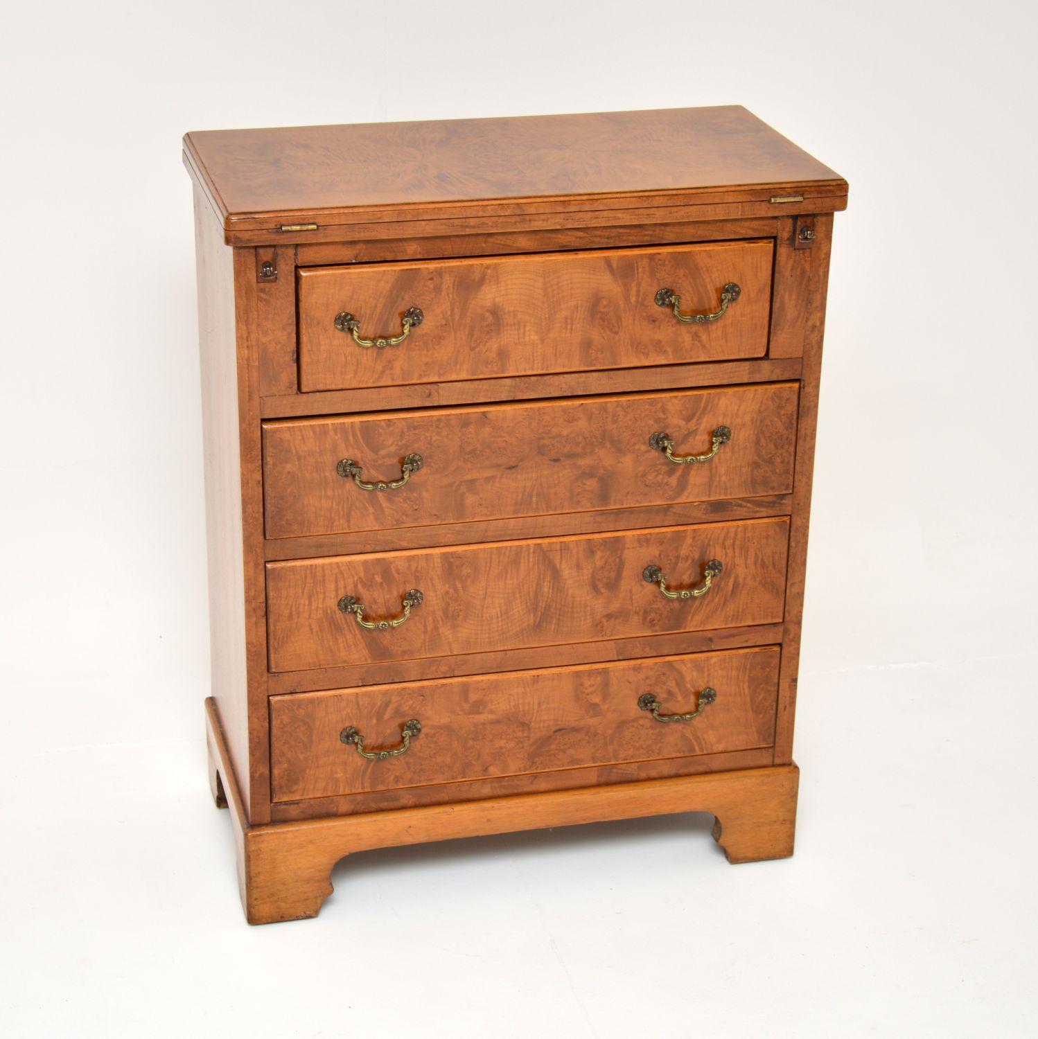 A smart and useful small antique Georgian style burr walnut bachelors chest of drawers. This was made in England, it dates from around the 1930’s.

It is a lovely, compact size and is of excellent quality. There is lots of storage space inside the