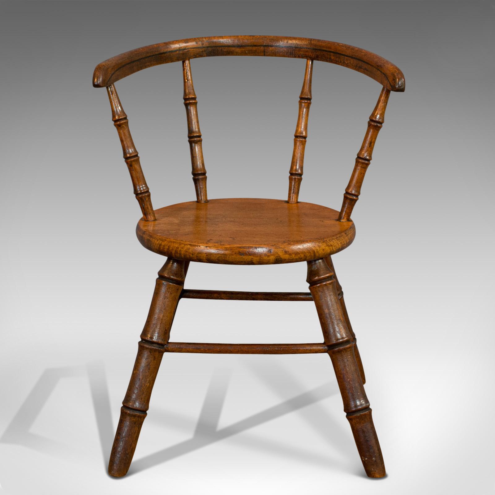 This is a small antique Windsor chair. An English, oak apprentice piece redolent of the High Wycombe school of miniature furniture, dating to the Victorian period, circa 1870. 

Superb chair realized in the miniature
Displays a desirable aged