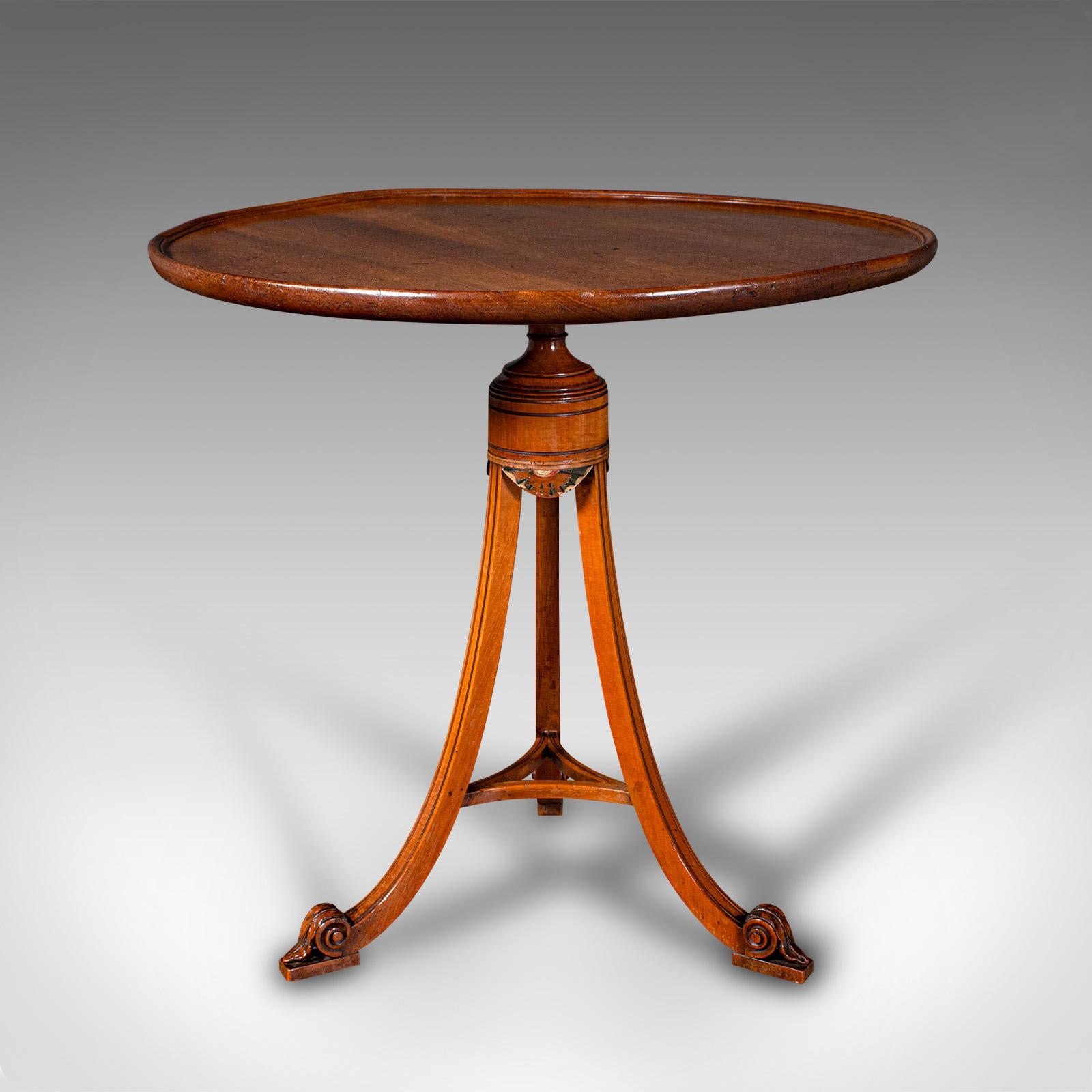 This is a small antique wine table. An English, mahogany and satinwood tripod lamp table, dating to the Regency period and later, circa 1820.

Graceful craftsmanship with a delightful eye-catching colour
Displays a desirable aged patina and in good
