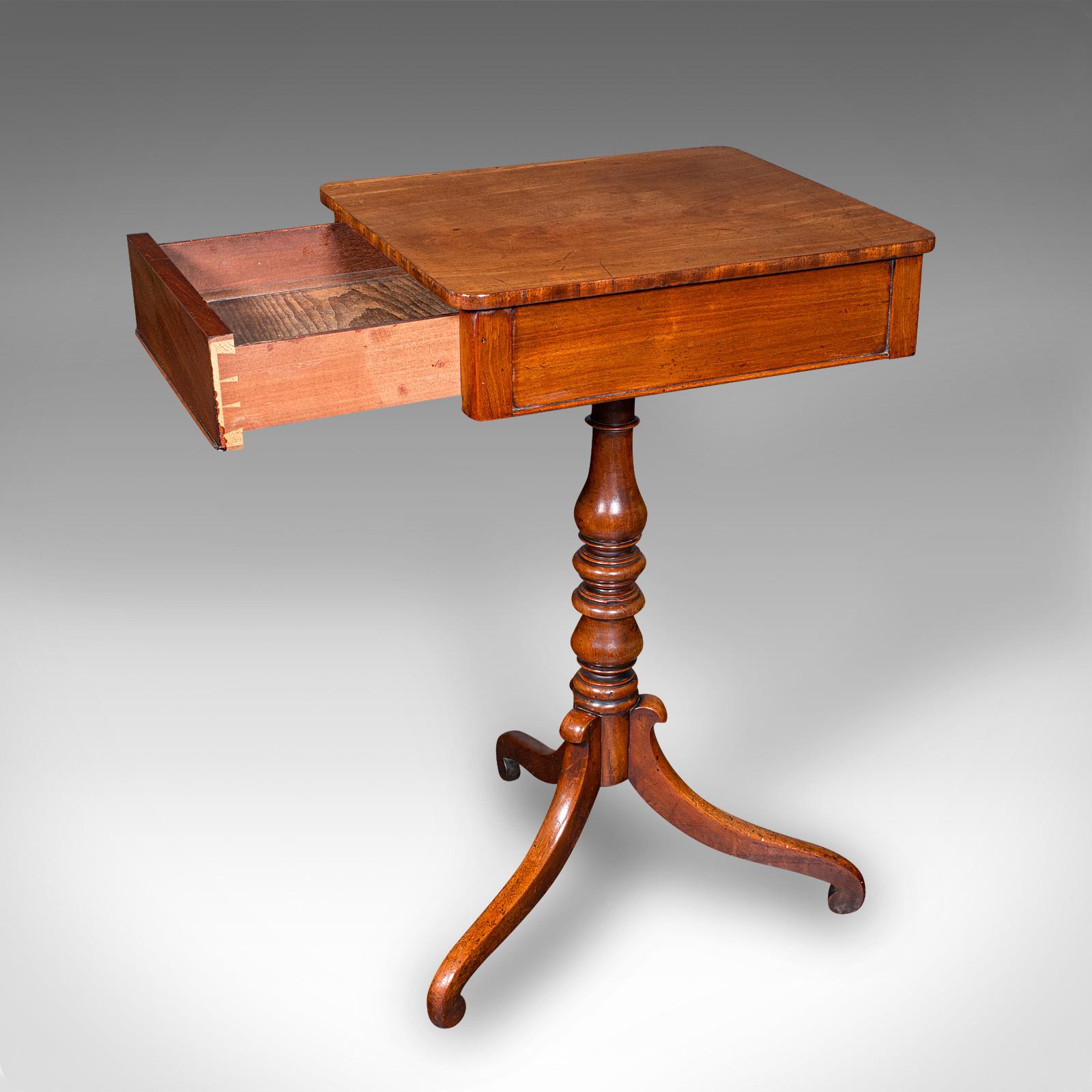 This is a small antique wine table. An English, mahogany side table with concealed drawer, dating to the Regency period, circa 1820.

Beautiful form and finish, with wonderful Regency detail
Displays a desirable aged patina and in good order
Select